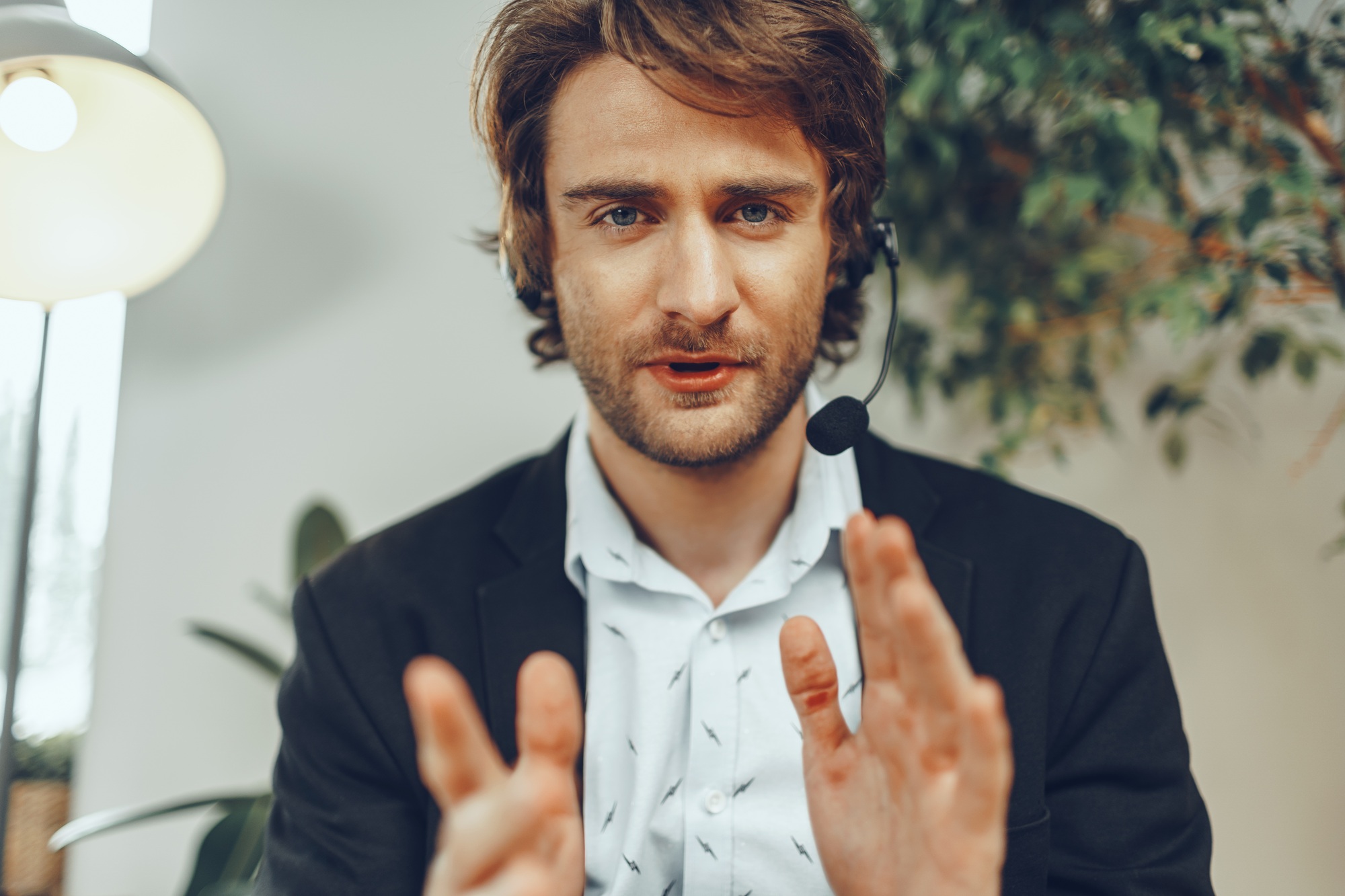 Bearded man businessman with headset having online business conversation