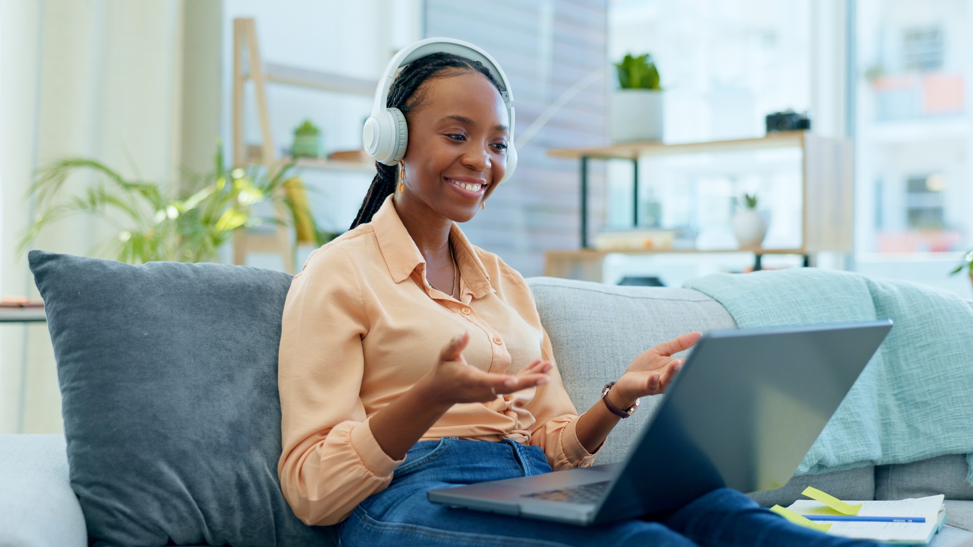 Black woman, laptop or phone call on house sofa for networking, b2b customer deal or freelance busi