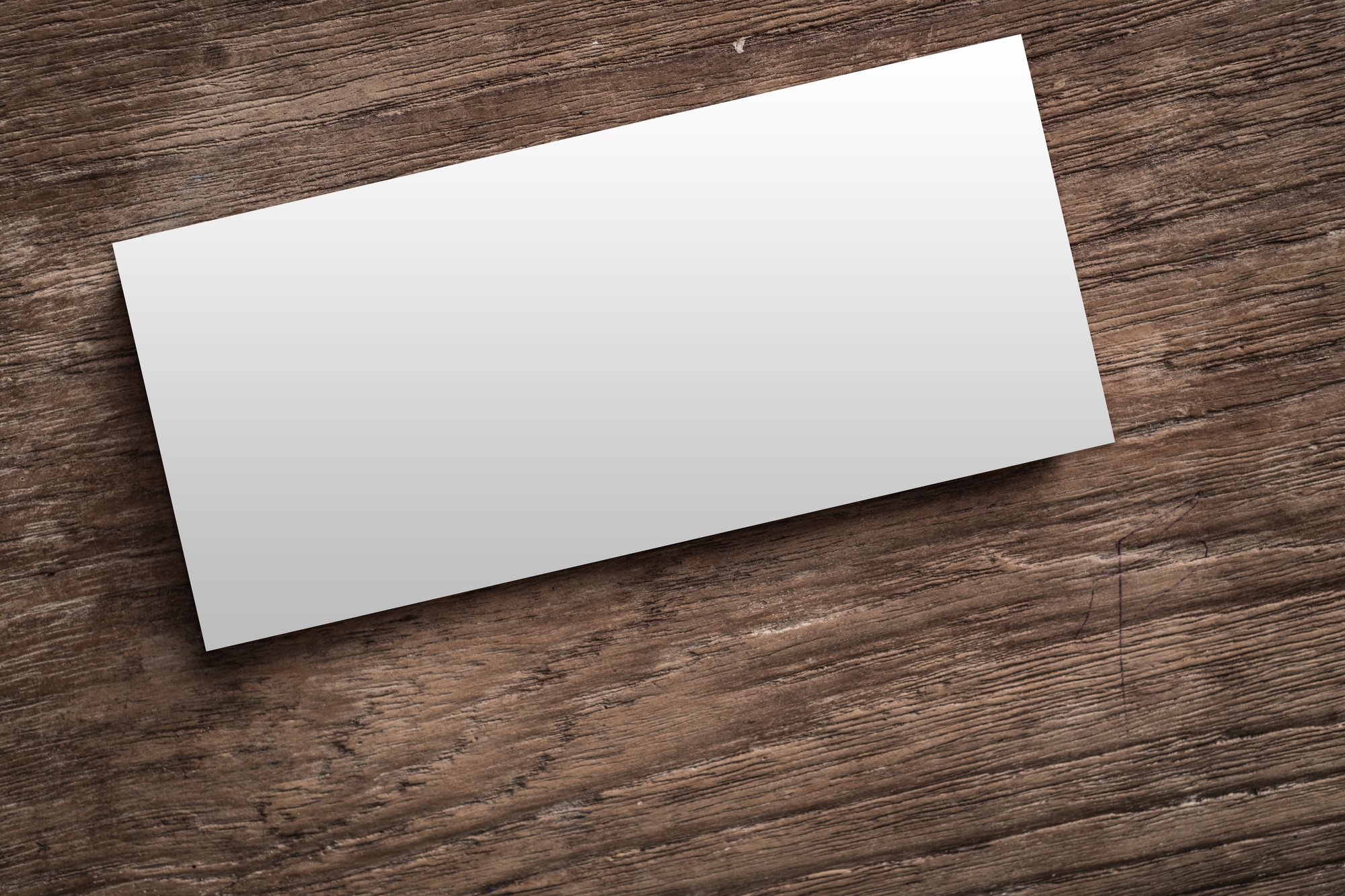 Blank corporate identity on wood background.