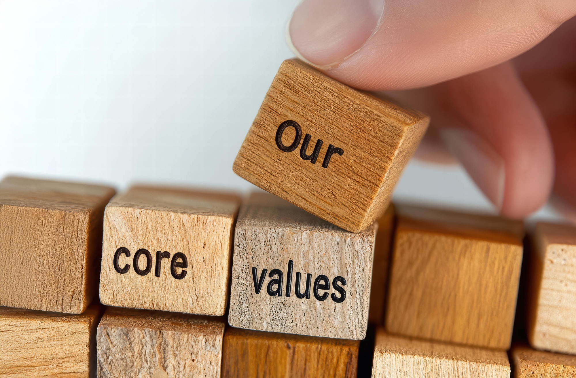 Building core values with wooden blocks on a table