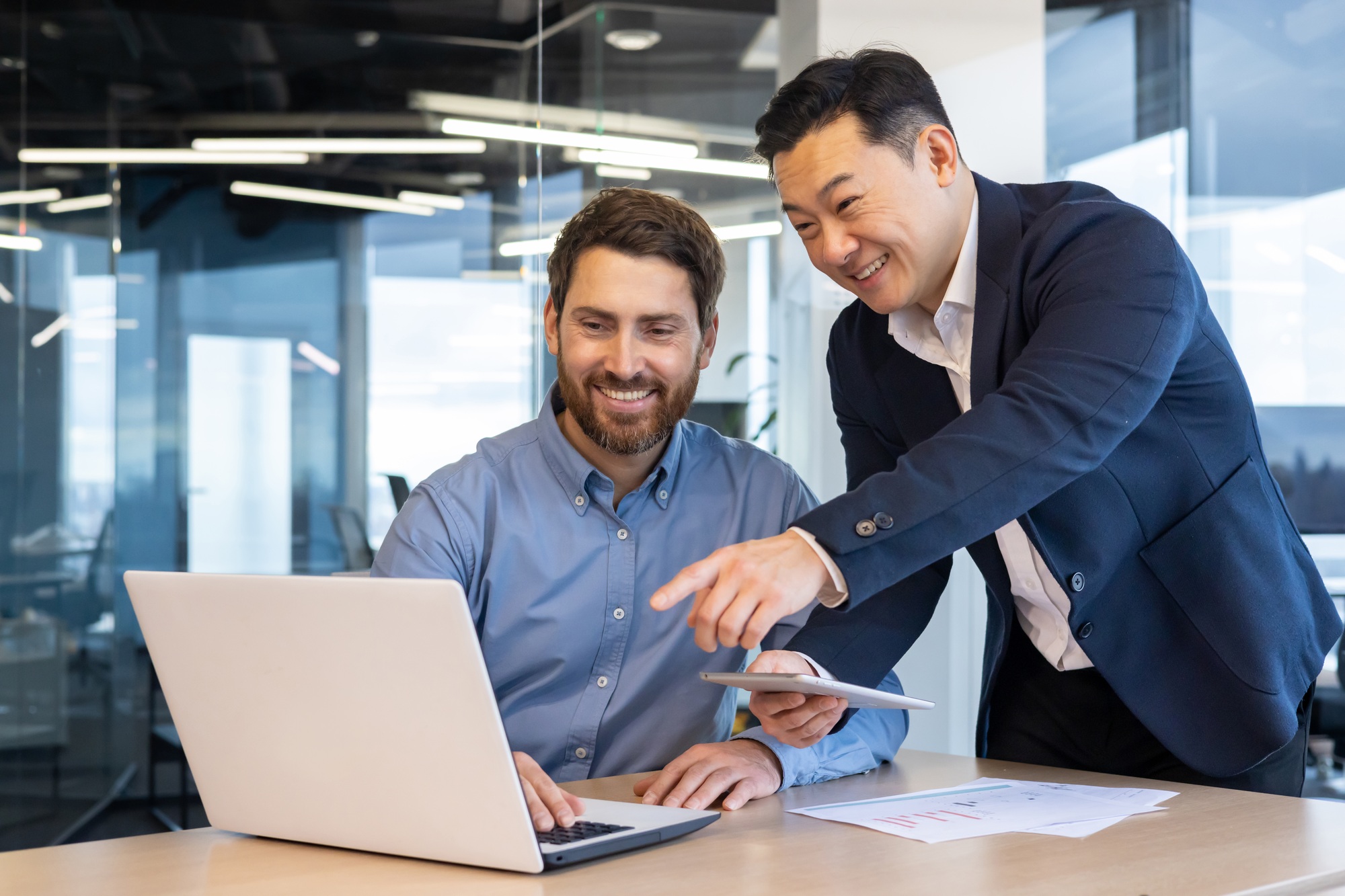 Business colleagues collaborating in office environment, teamwork and partnership
