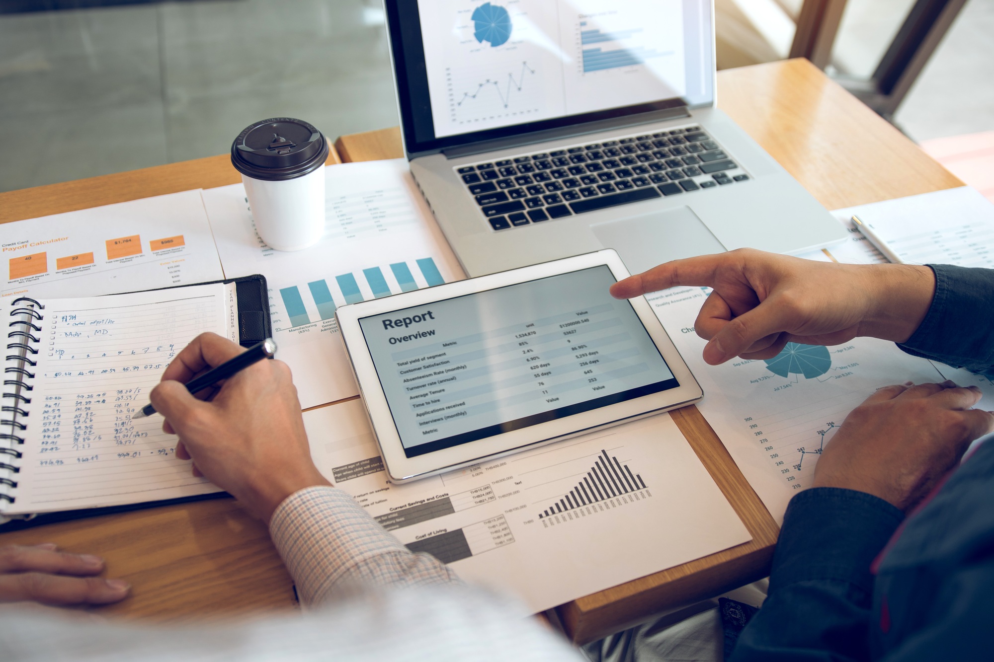 Business partnership coworkers using a tablet to analysis graph company financial budget