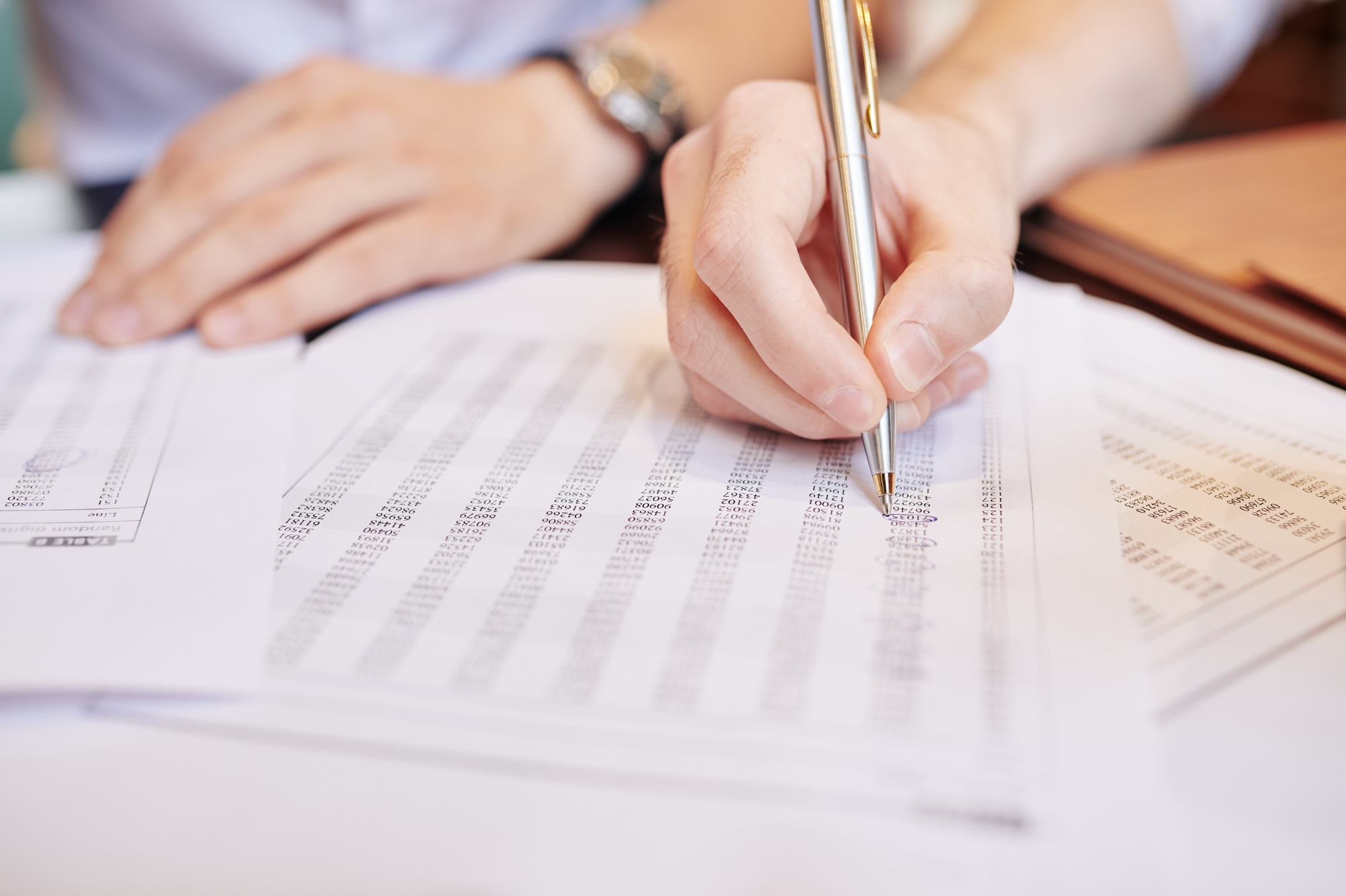 Business people analyzing document with numbers