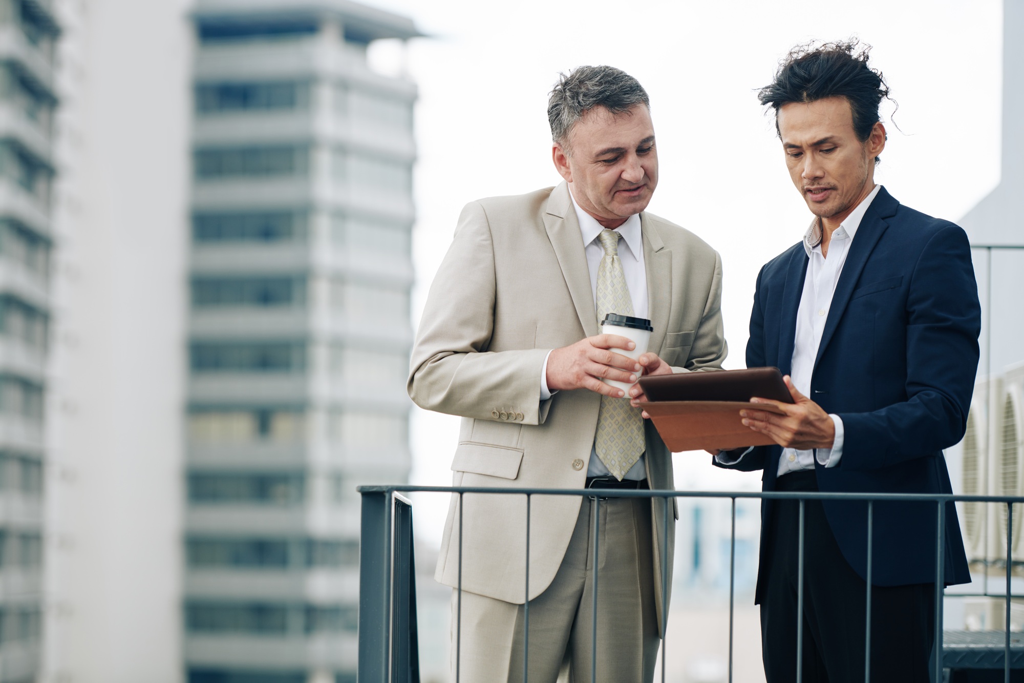 Business people discussing article