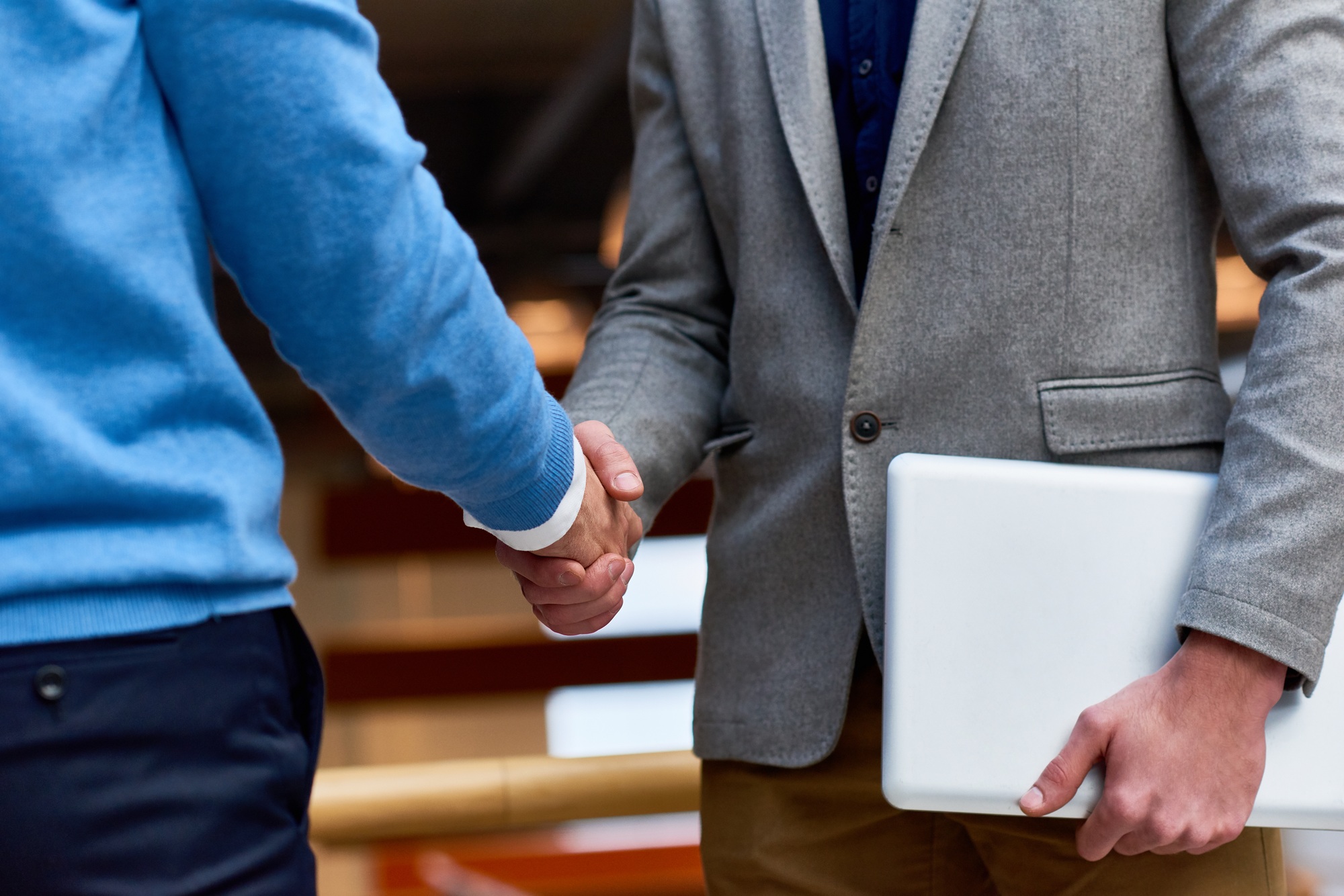 Business People Shaking Hands Indoors