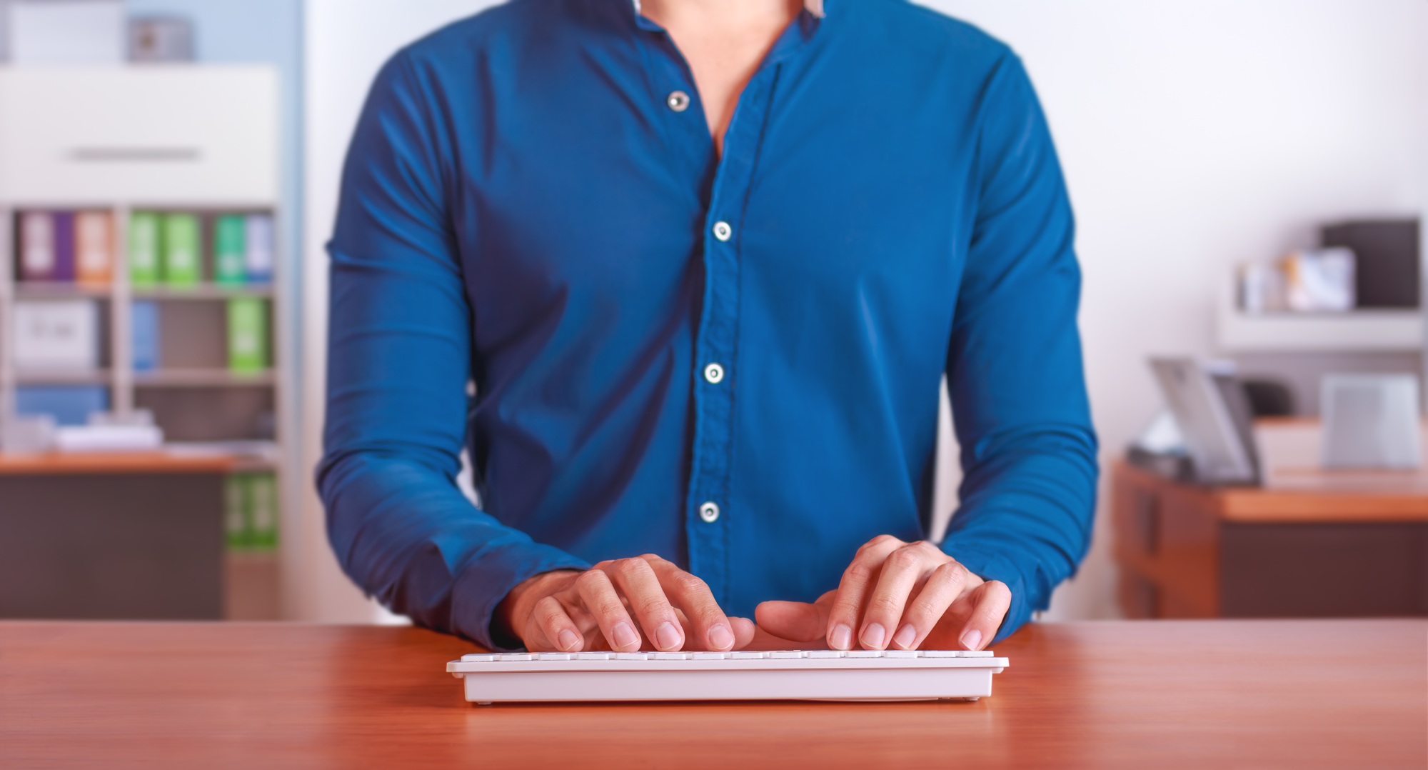 Business Professional Typing on Wireless Keyboard, Modern Workspace and Productivity Concept