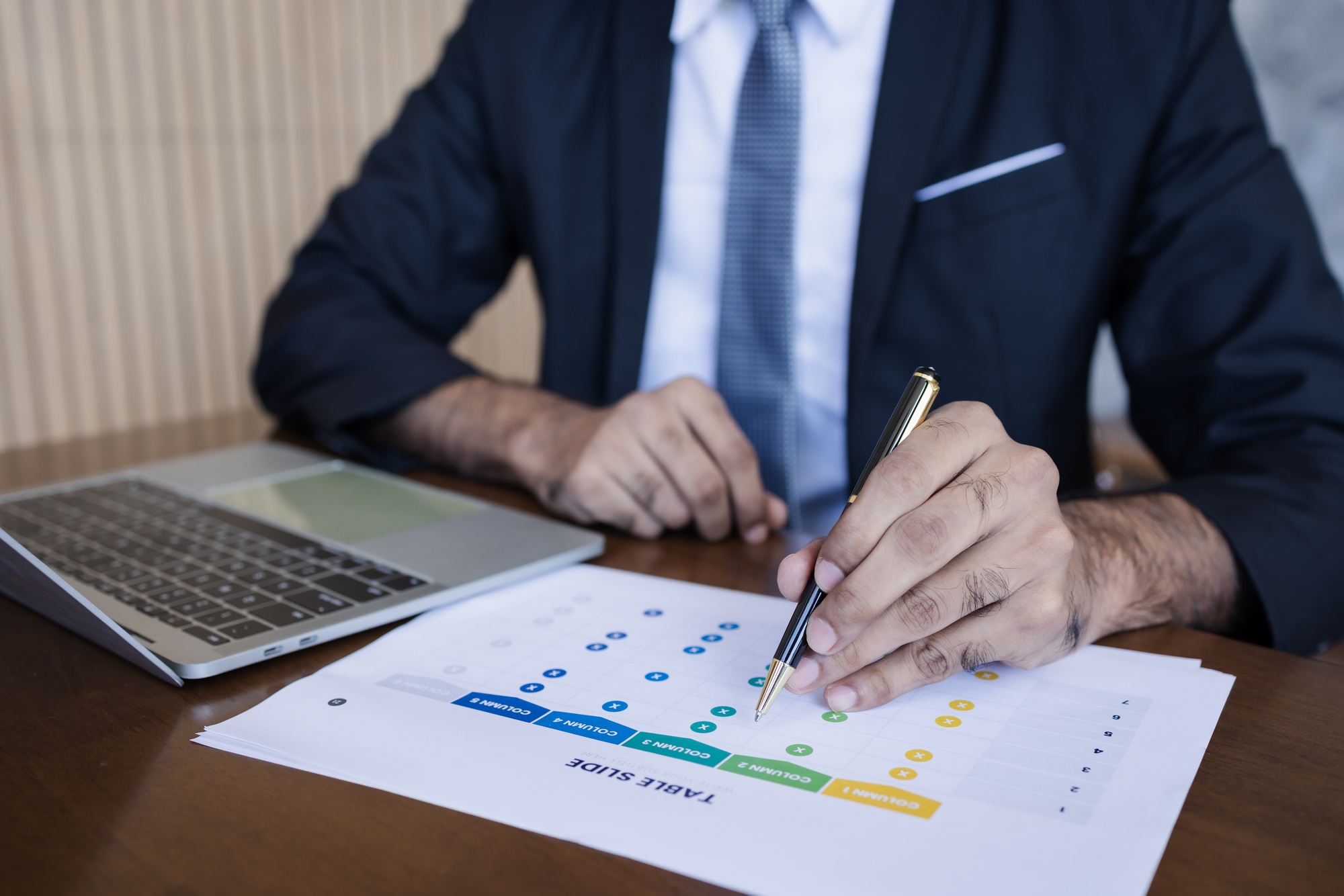 Businessman Analyzing Data Sheet: Strategic Planning
