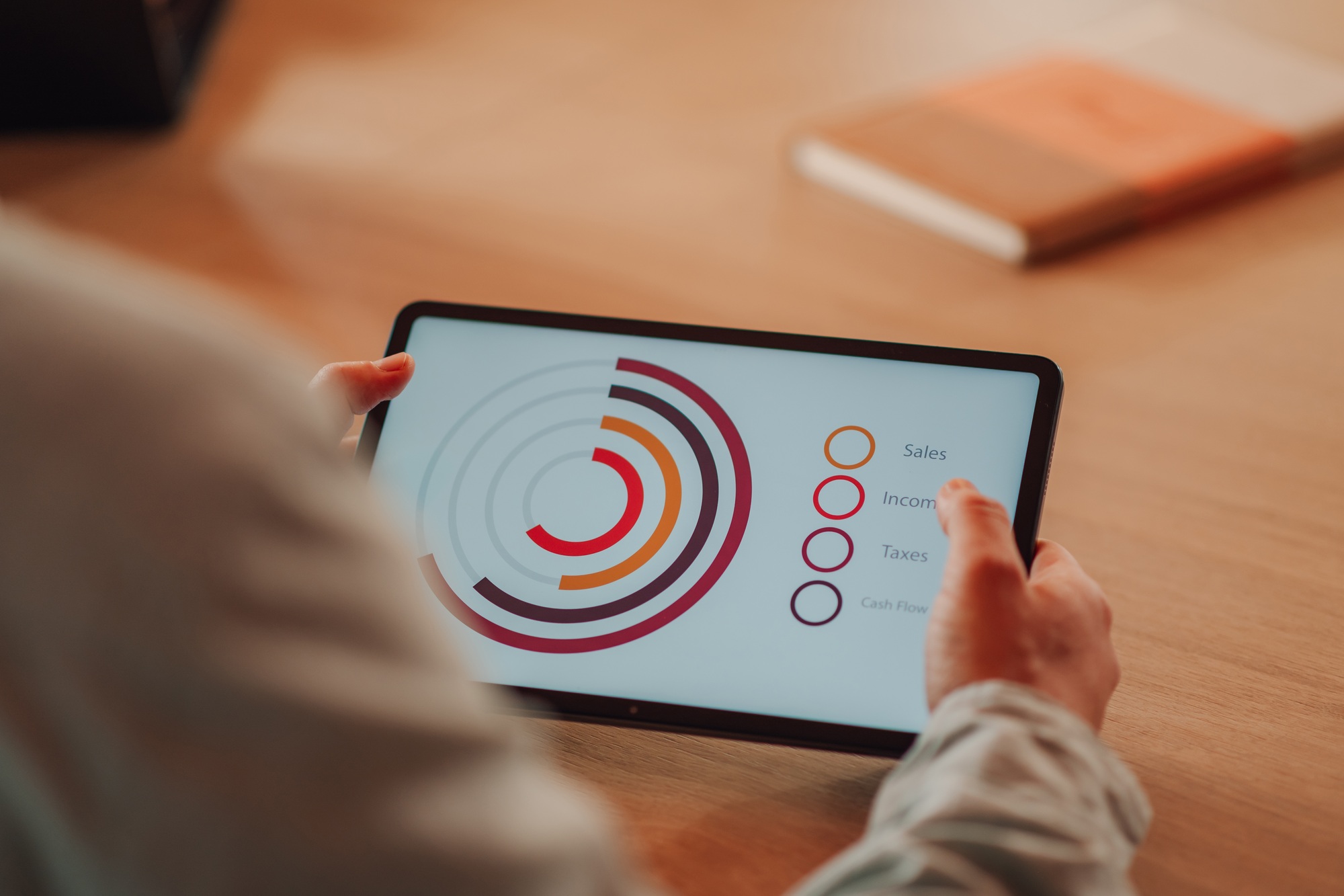 Businessman analyzing financial charts on digital tablet