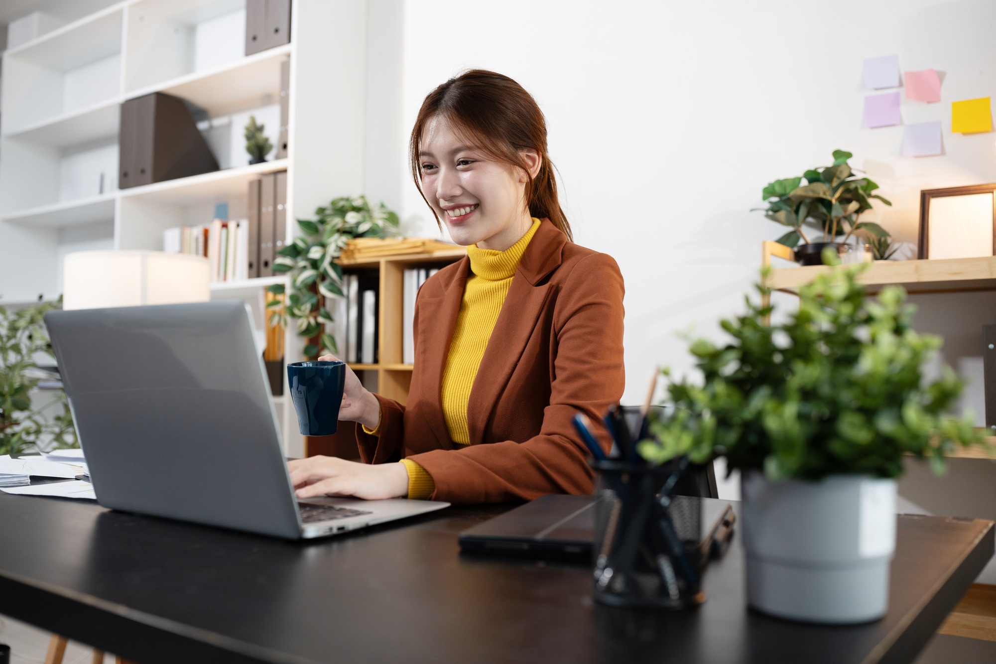 Businesswoman analyzing financial graphs, calculating company expenses.