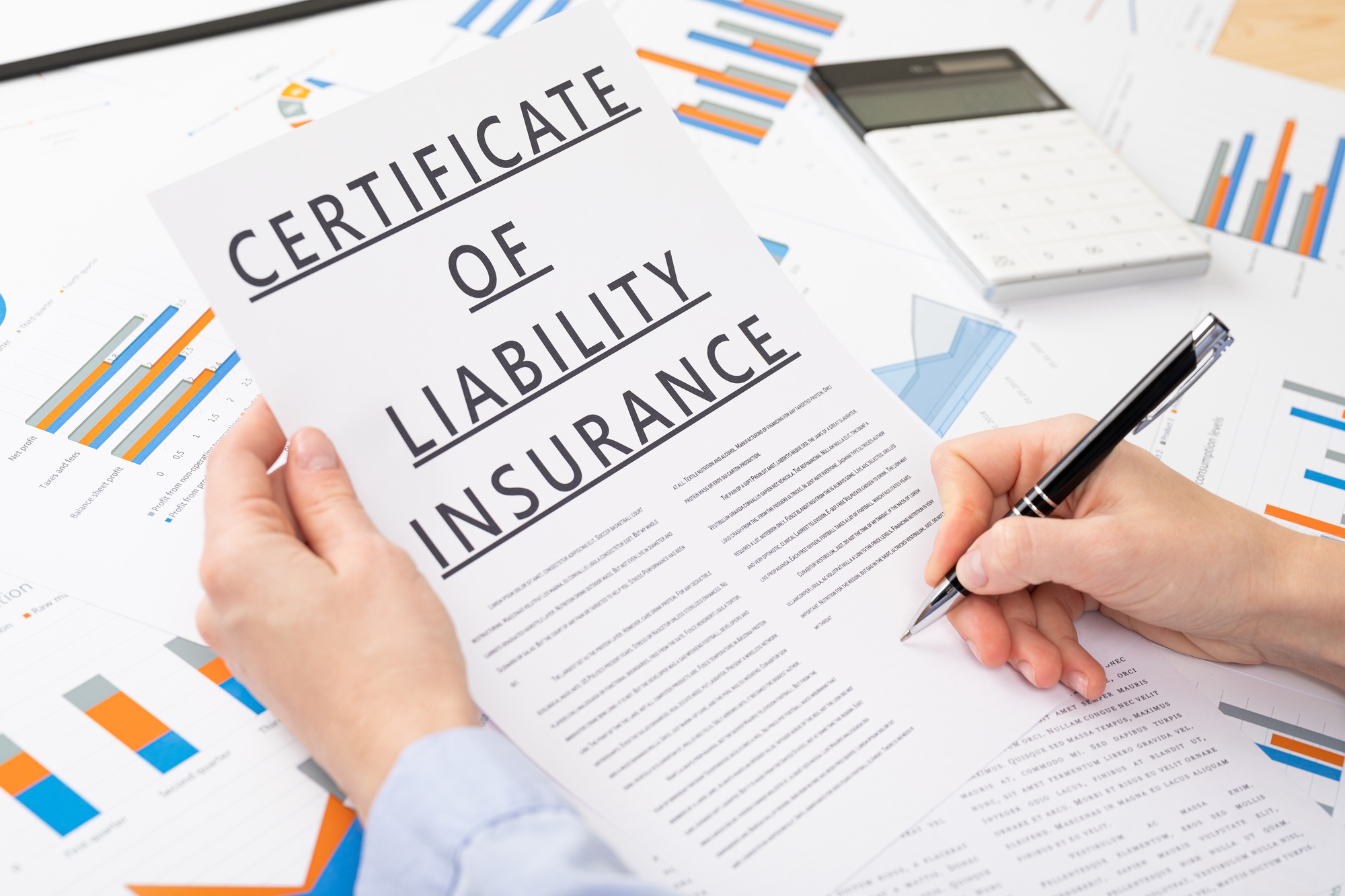 certificate of liability insurance concept, documents on the desktop