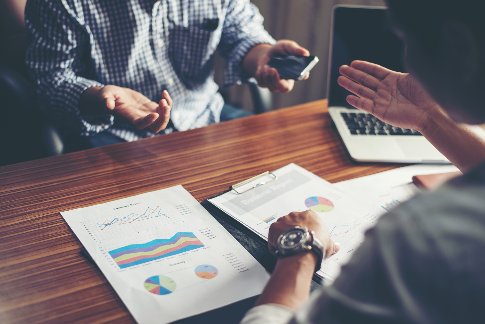 Close-up of Team Business people discussing a financial plan at office.