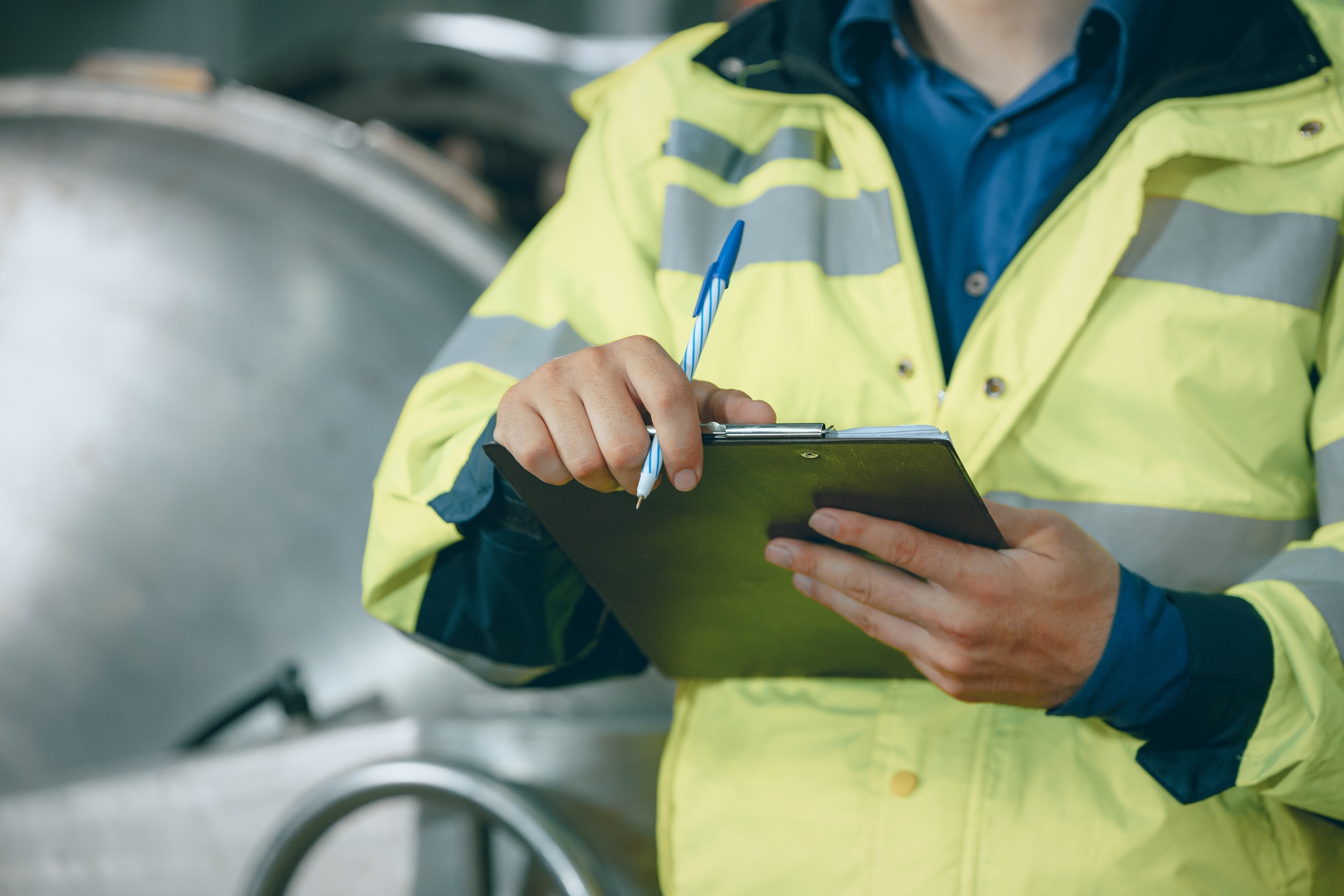 closeup engineer staff worker with checking schedule list write record maintenance replace service