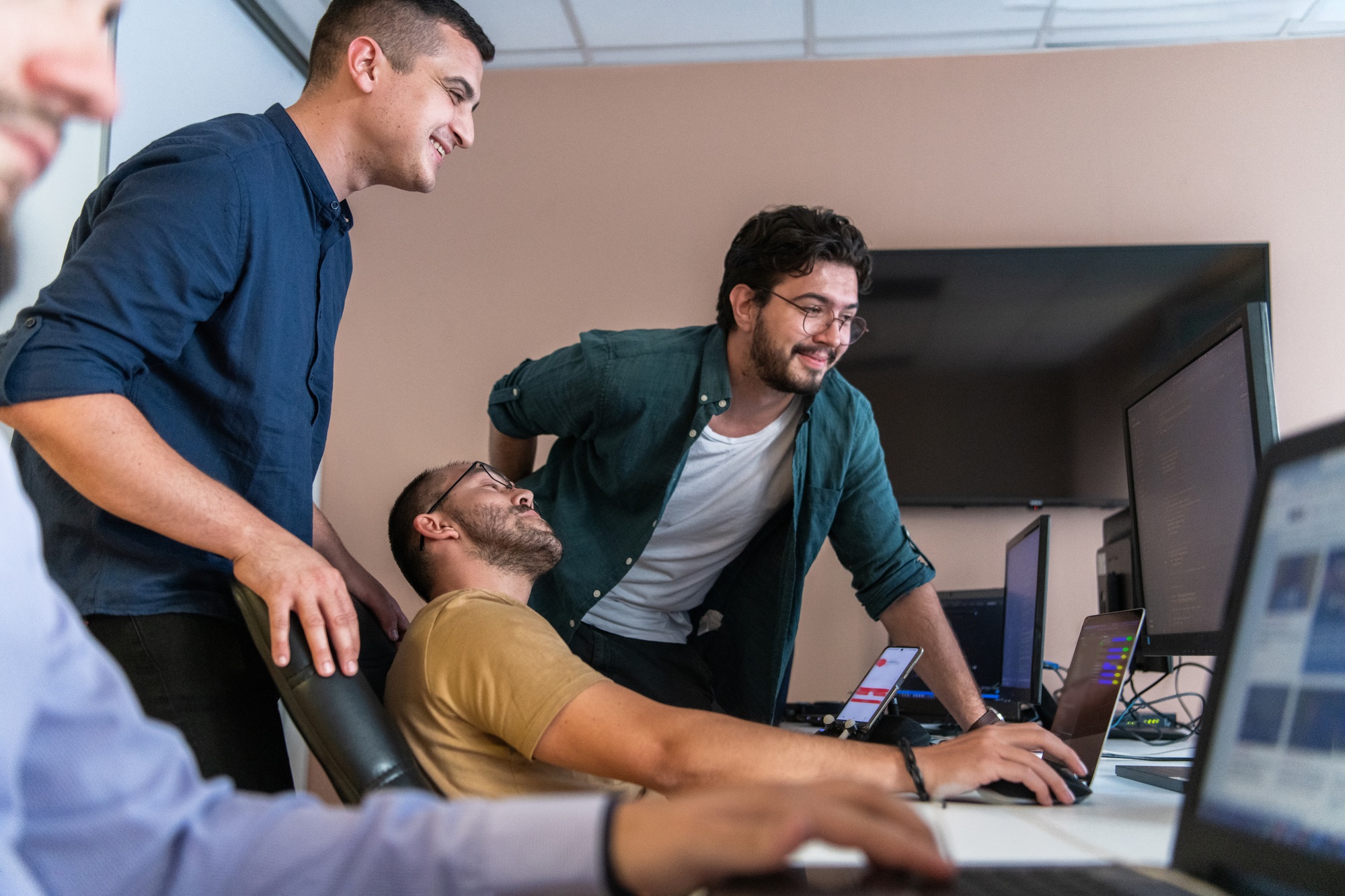 Collaborative Minds: A Team of Programmers Tackling Challenges Together in the Office.