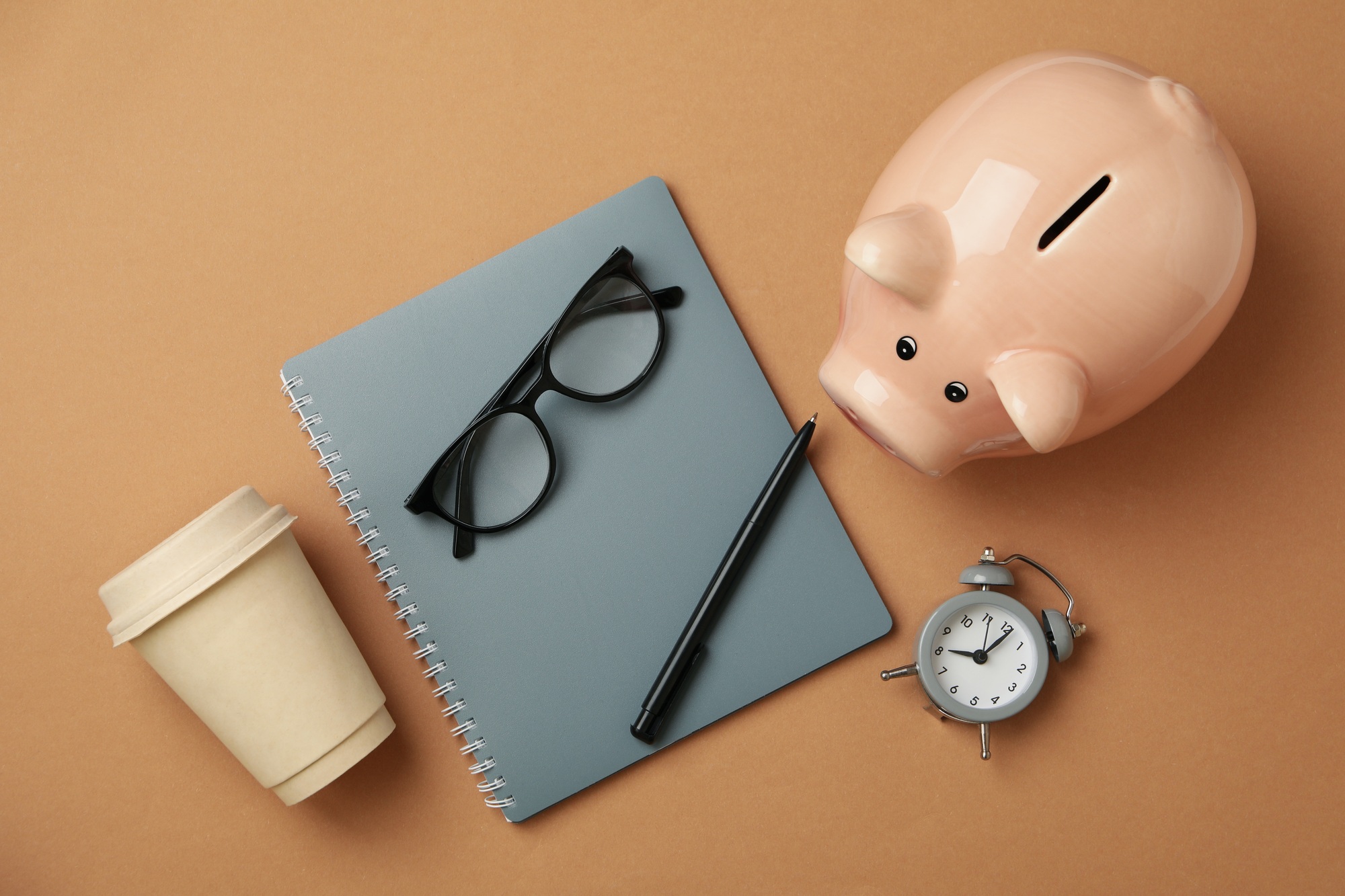 Concept of financial planning with piggy bank on craft background