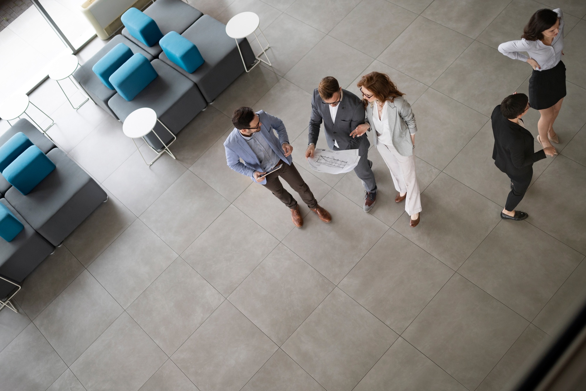 Confident business people reviewing project in office