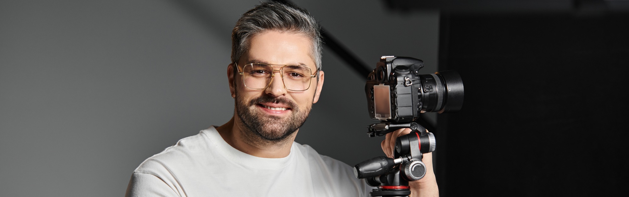 Creative professional capturing moments with a high end camera in a modern studio setting
