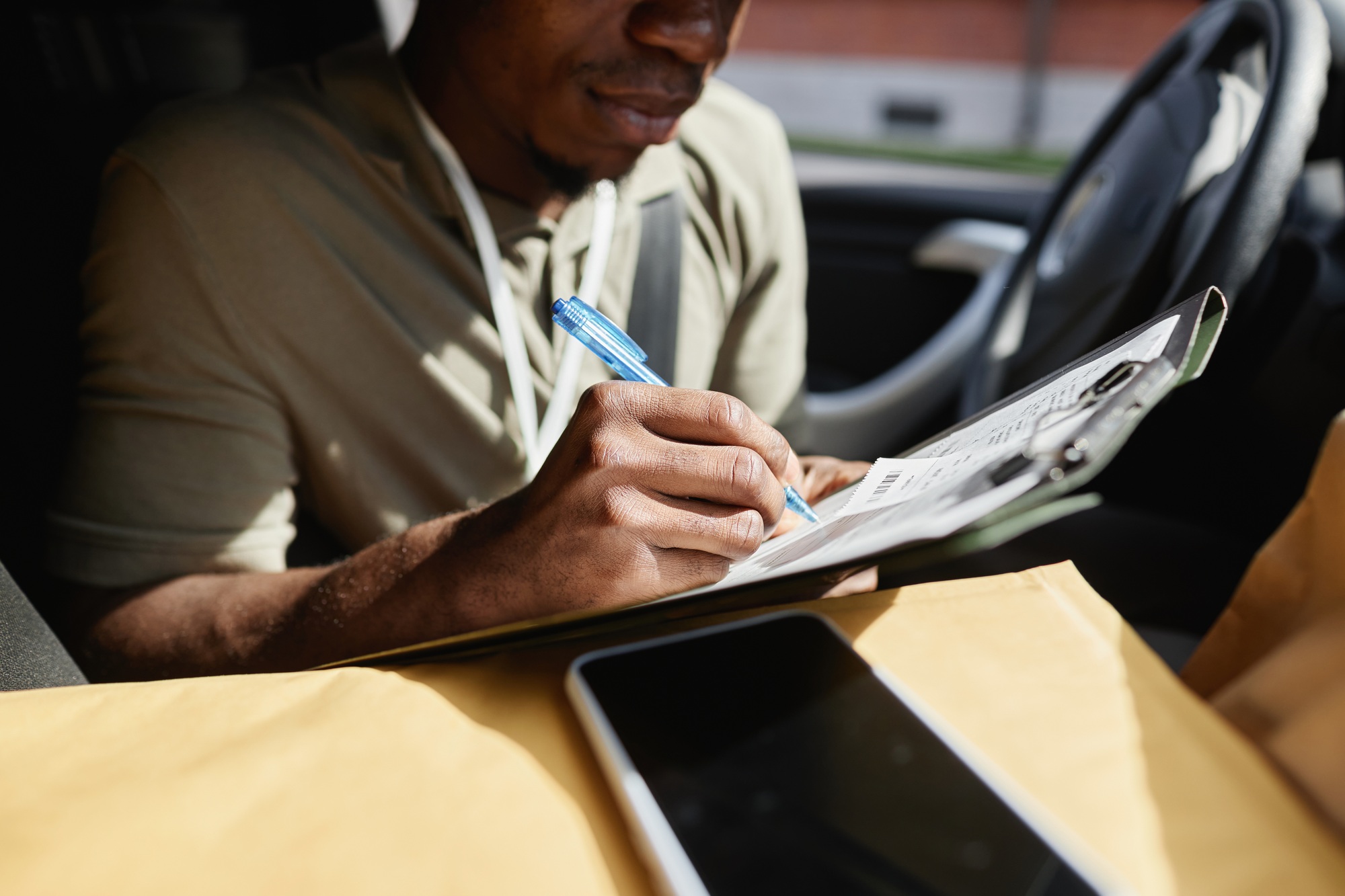 Delivery Man Filling Documents