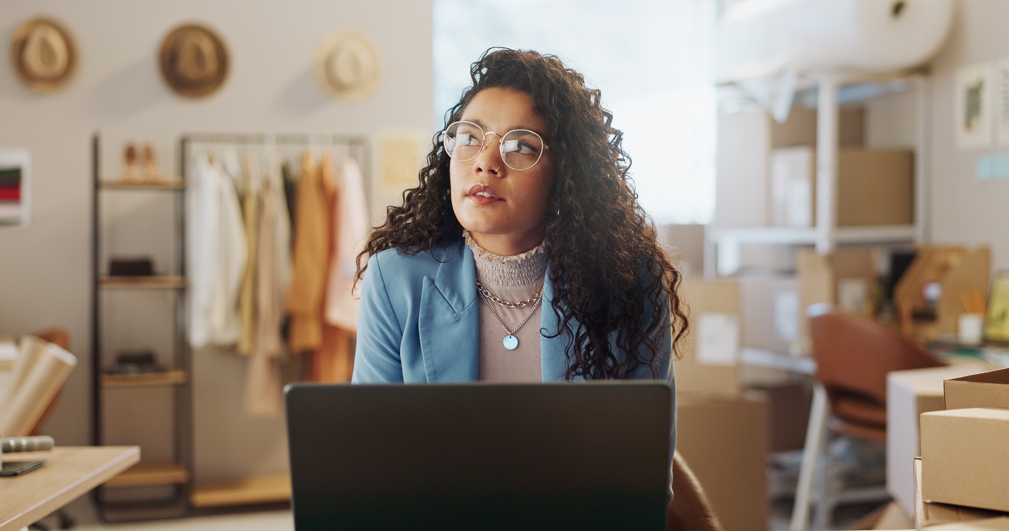 Entrepreneur, thinking and woman with a laptop, ecommerce and solution with startup, website inform