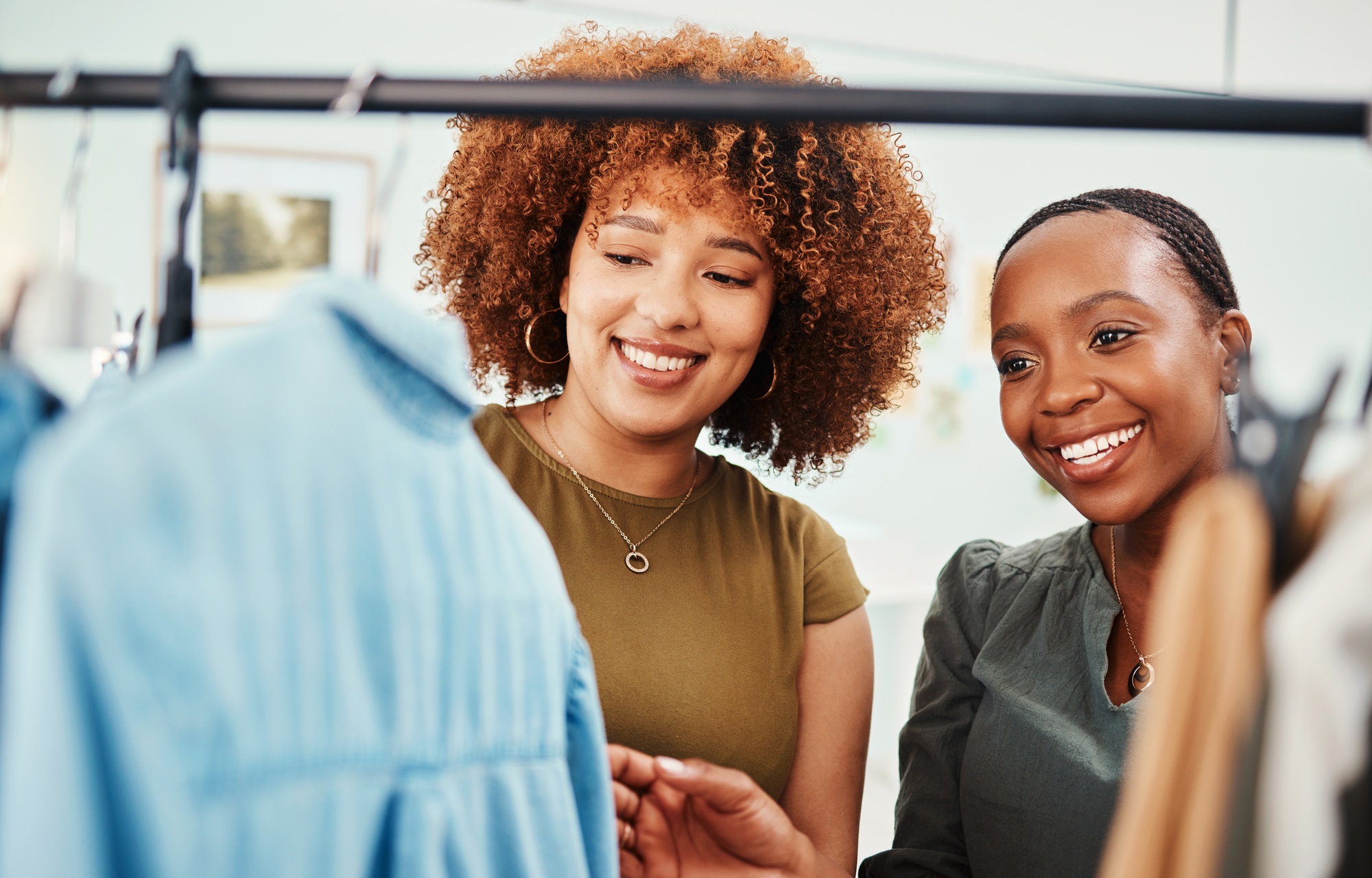 Fashion, shopping and women in a boutique for clothes, inspection and retail customer. Happy, toget