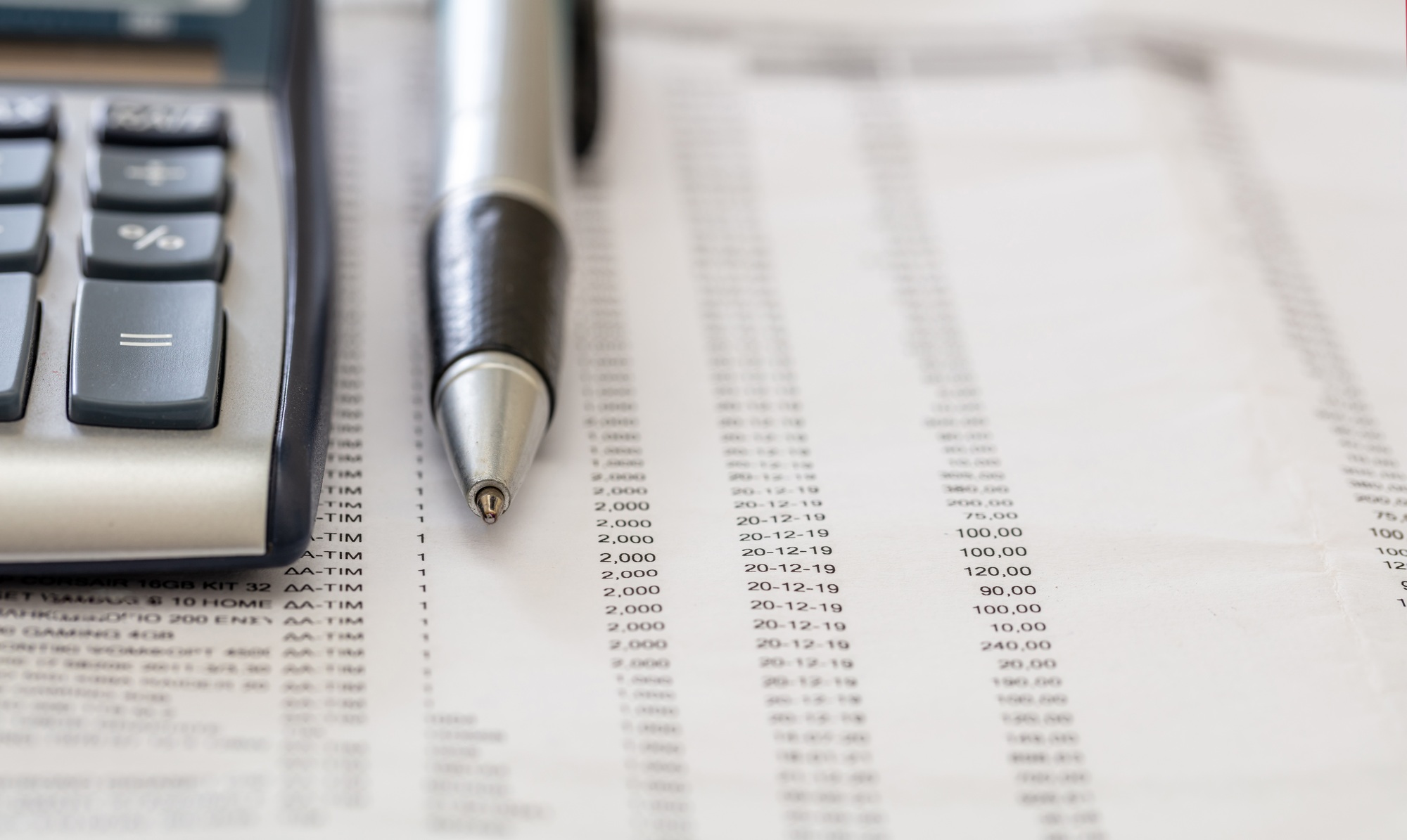 Financial accounting. Pen and calculator on business report