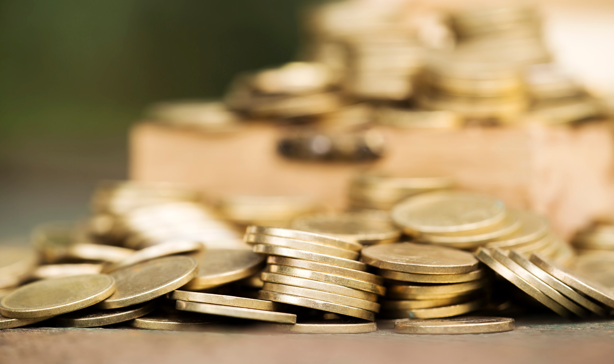 Financial planning concept - gold money coins background