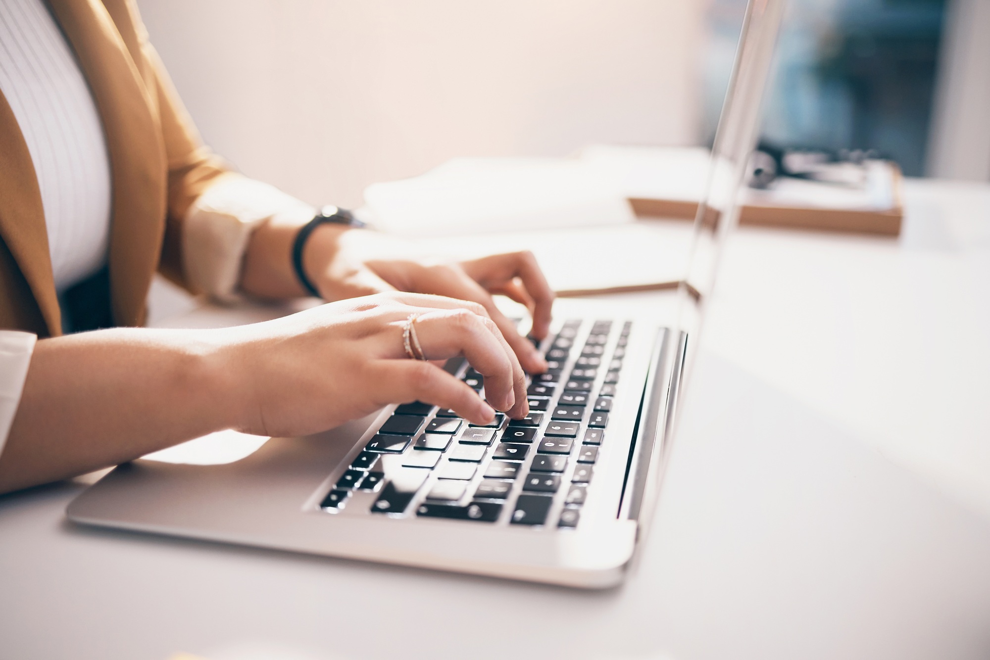 Hands typing, laptop and office with black woman, schedule and planning for strategy, goals and mis