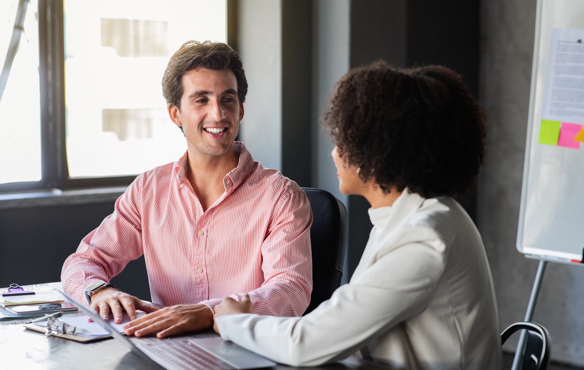 Handsome young man attending job interview with HR officer