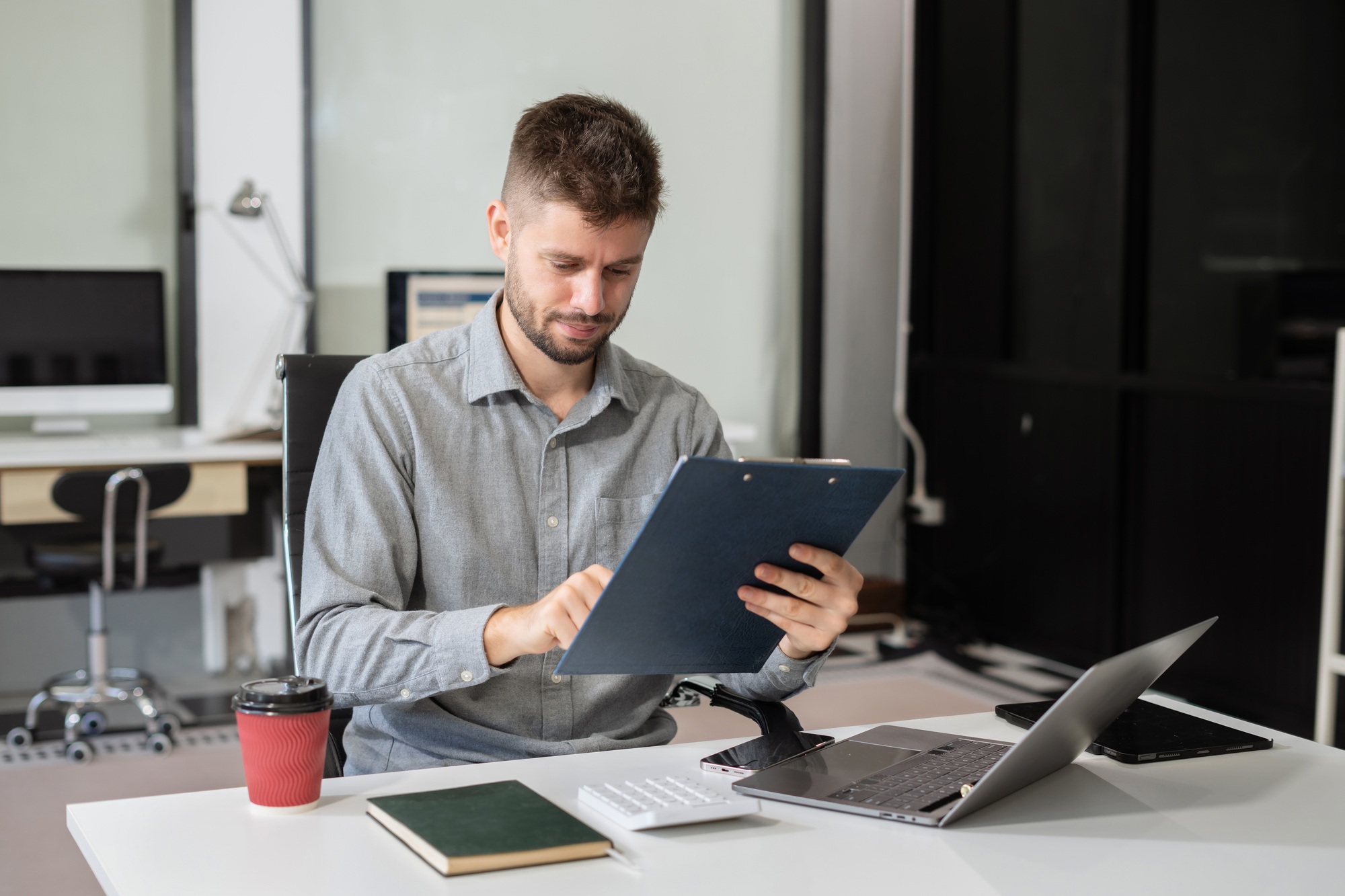 Happy man, entrepreneur, small business owner working online.