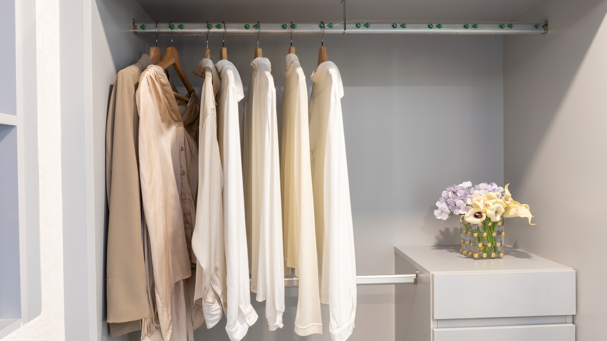 Interior design Stylish clothes with shoes and accessories in boutique. Large mirror