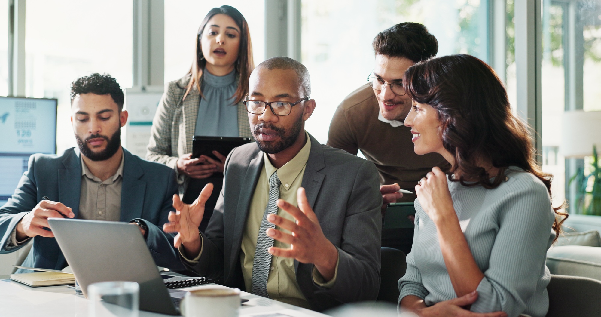 Meeting, talking or business people on laptop for finance feedback and discussion or teamwork. Corp