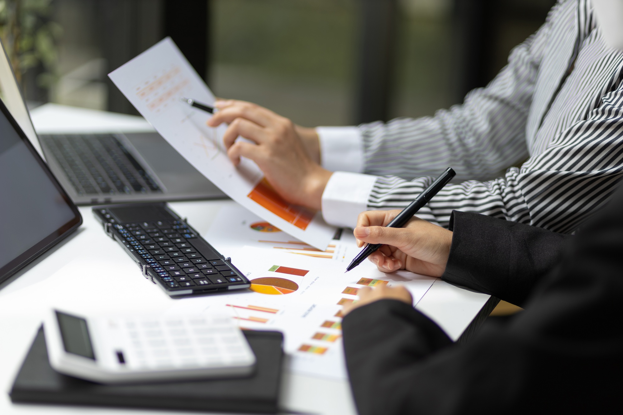Meeting to discuss business consultants, plan budgets for new business projects.