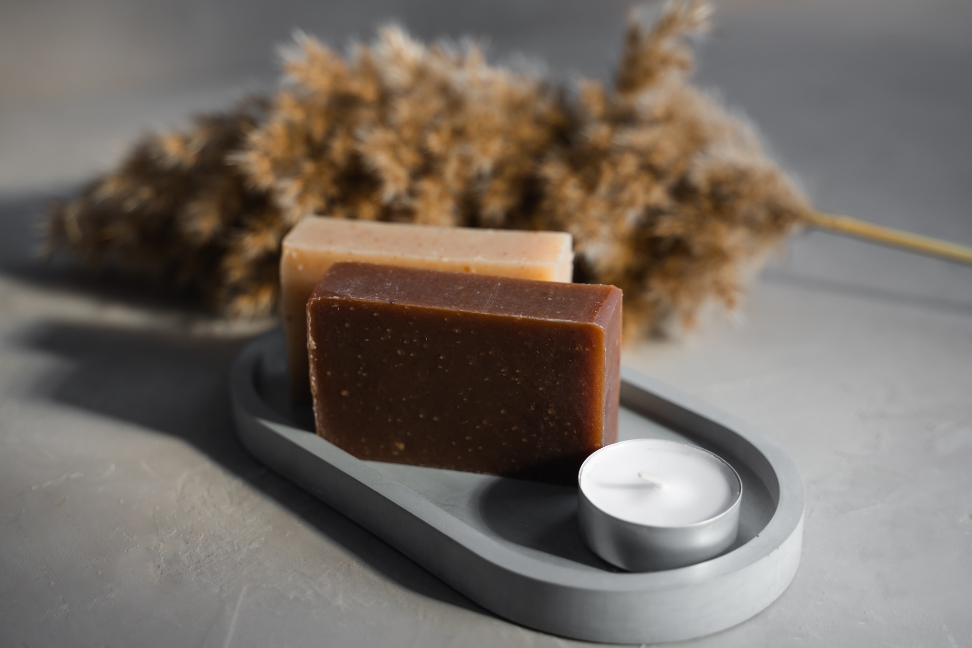 Natural soap on a gray soap dish. Bathroom. Handmade products.