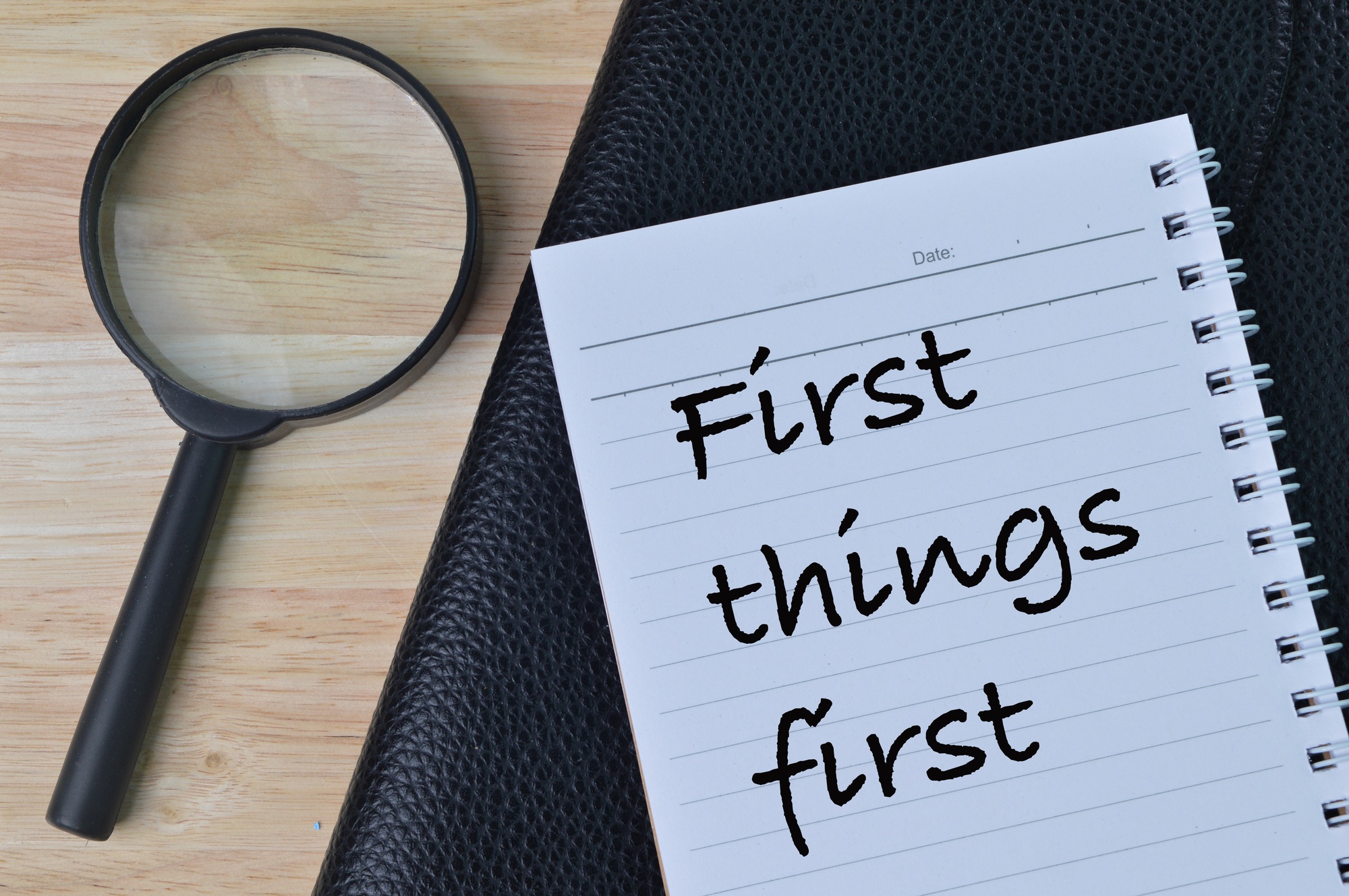 Notebook written with text FIRST THINGS FIRST.