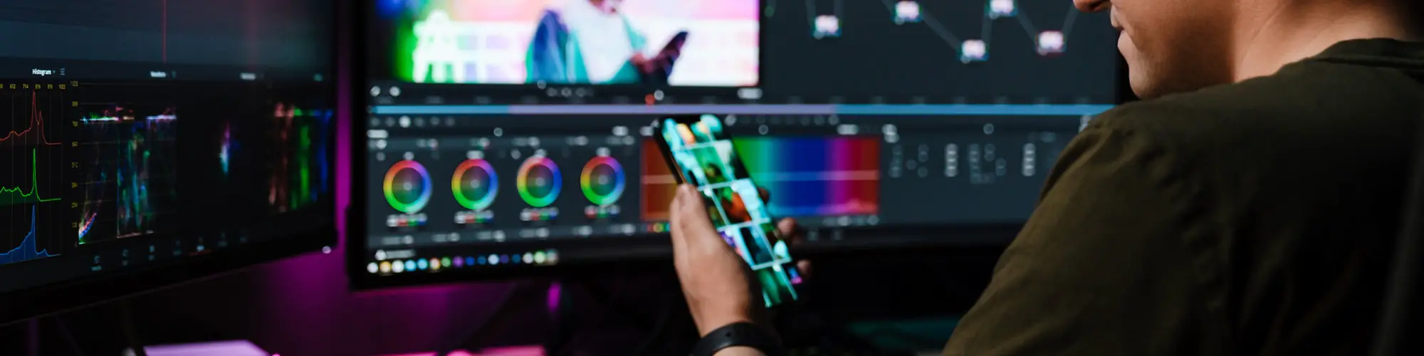 Back view of a young white man video editor
