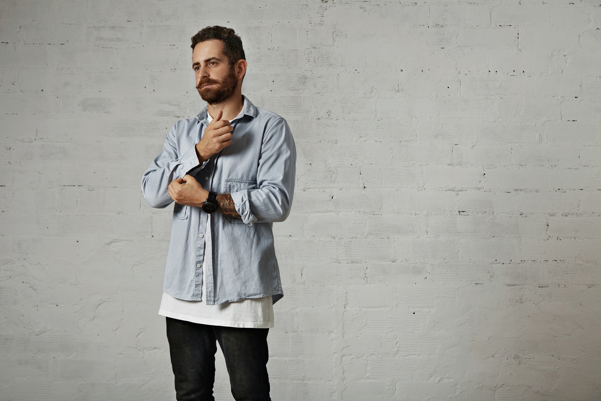Portrait of a man in white t-shirt and denim