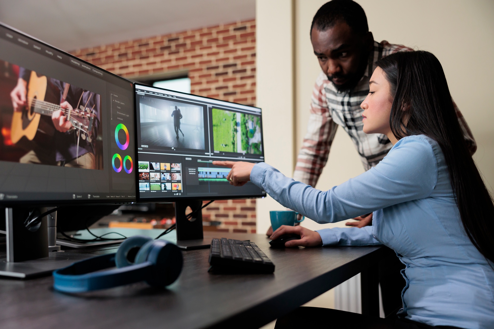 Professional digital movie editor sitting at desk while improving film frames and improving footage
