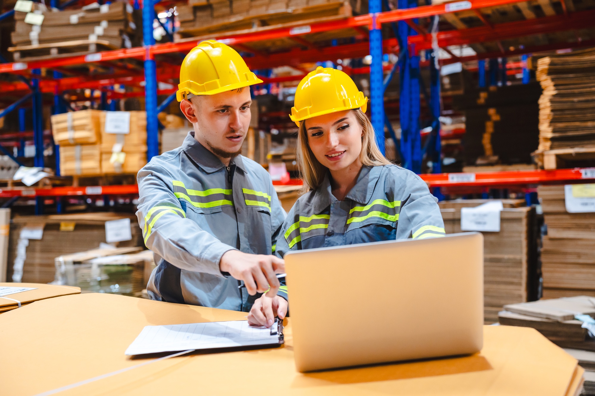 Professional worker supervisor inspector packaging stock order at factory warehouse