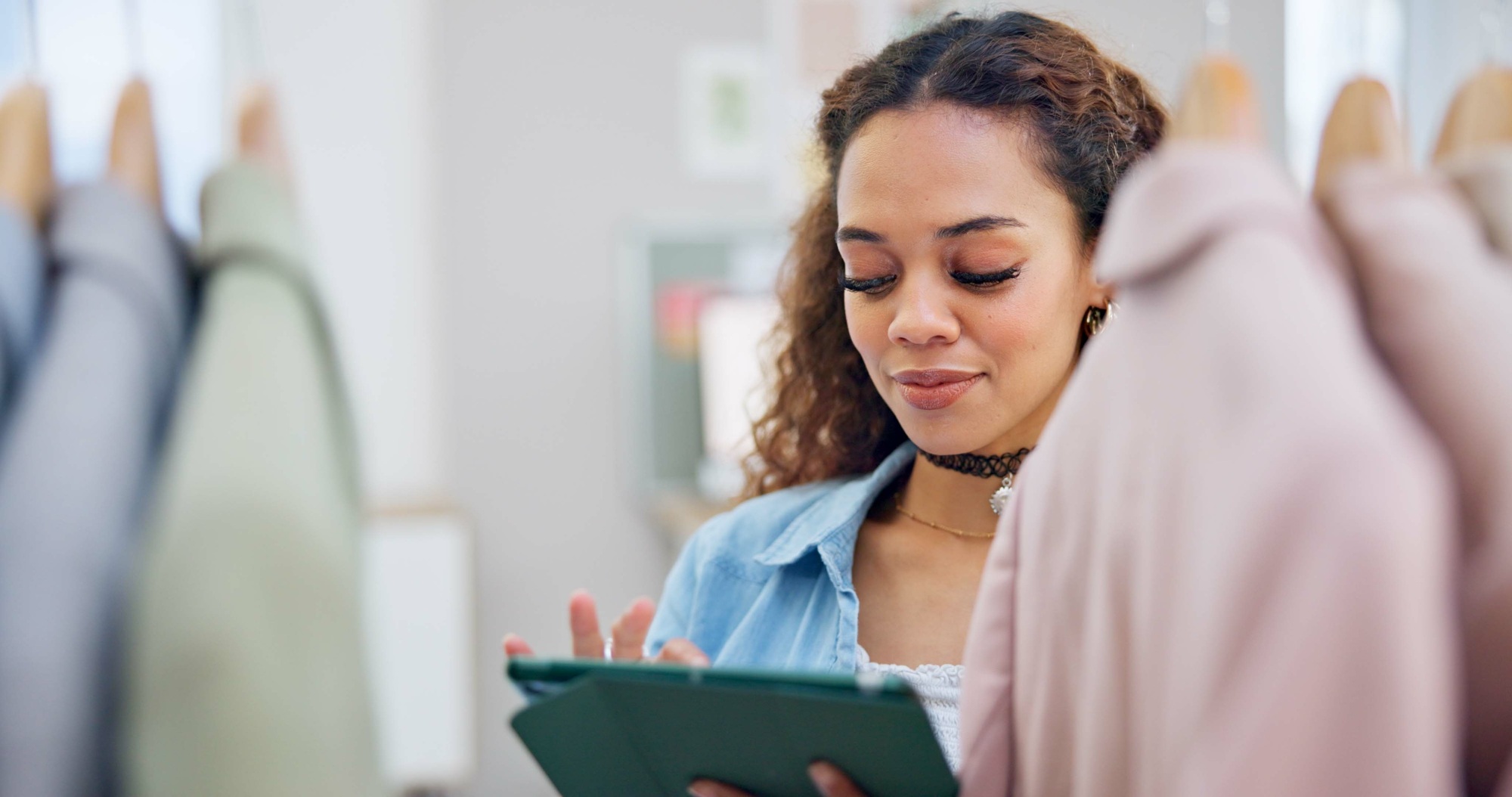 Retail, ecommerce and woman with a tablet, store and inventory with connection, fashion or typing.