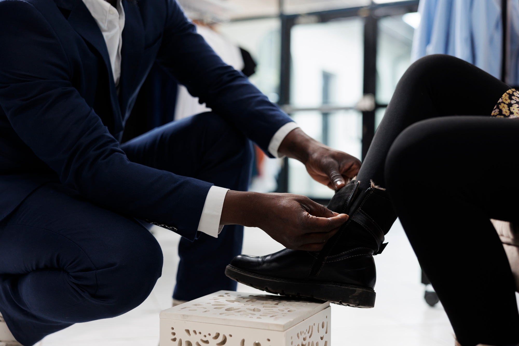 Retail employee helping african american client