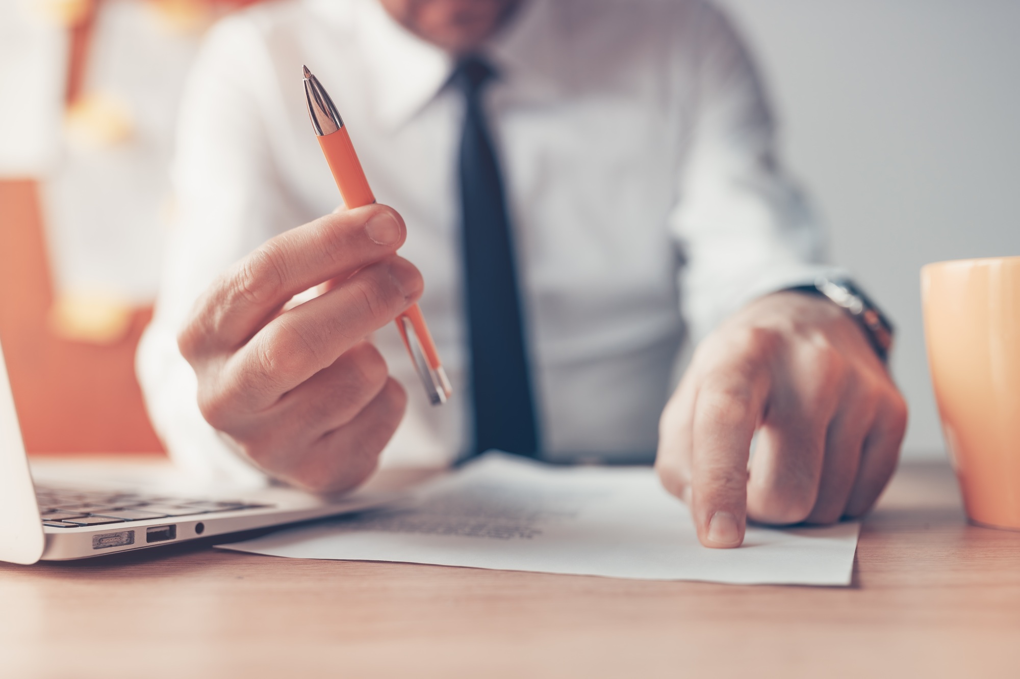 Sign the contract, businessman offering the pencil and agreement papers