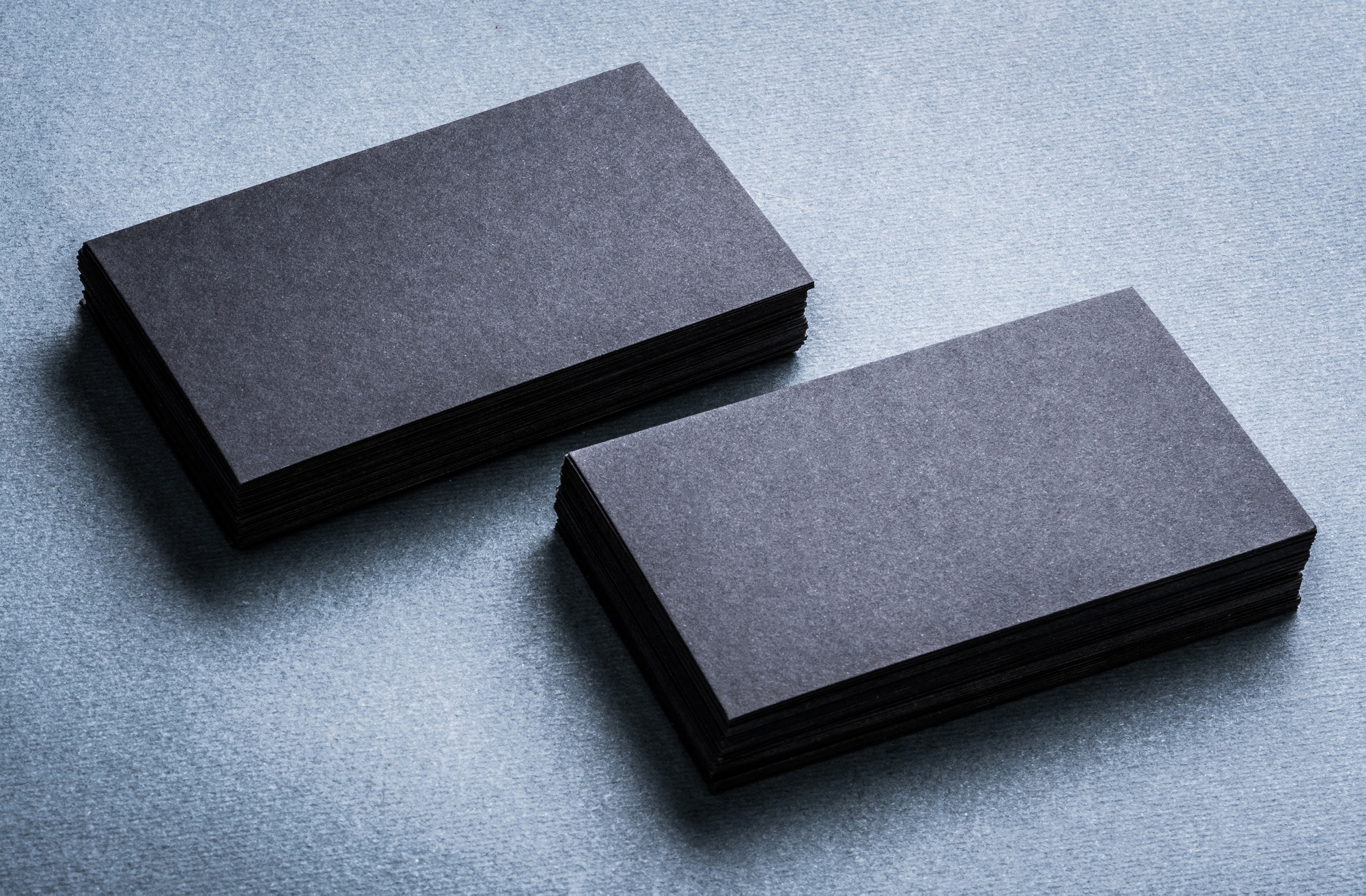 Stacks of black blank business cards