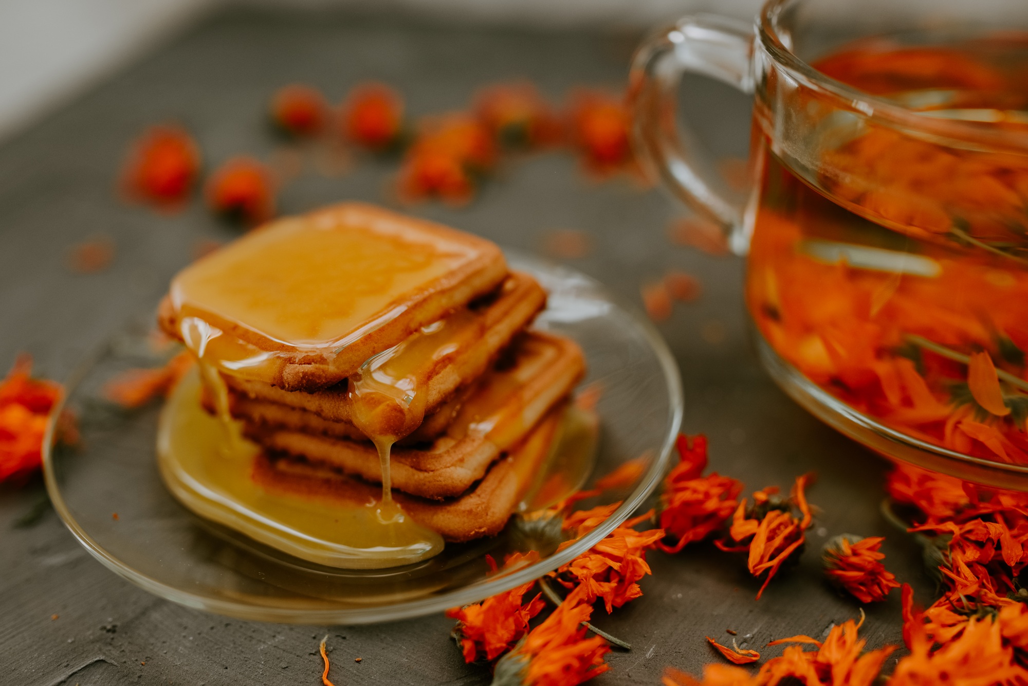 The honey on baked goods. Orange calendula flower tea