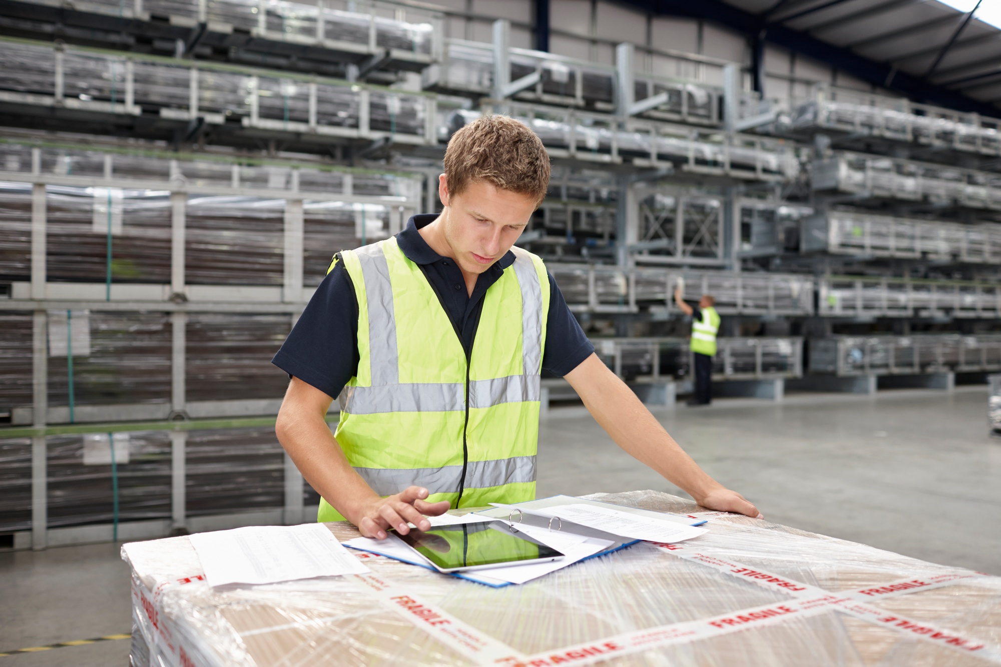 Warehouse worker preparing order in engineering warehouse