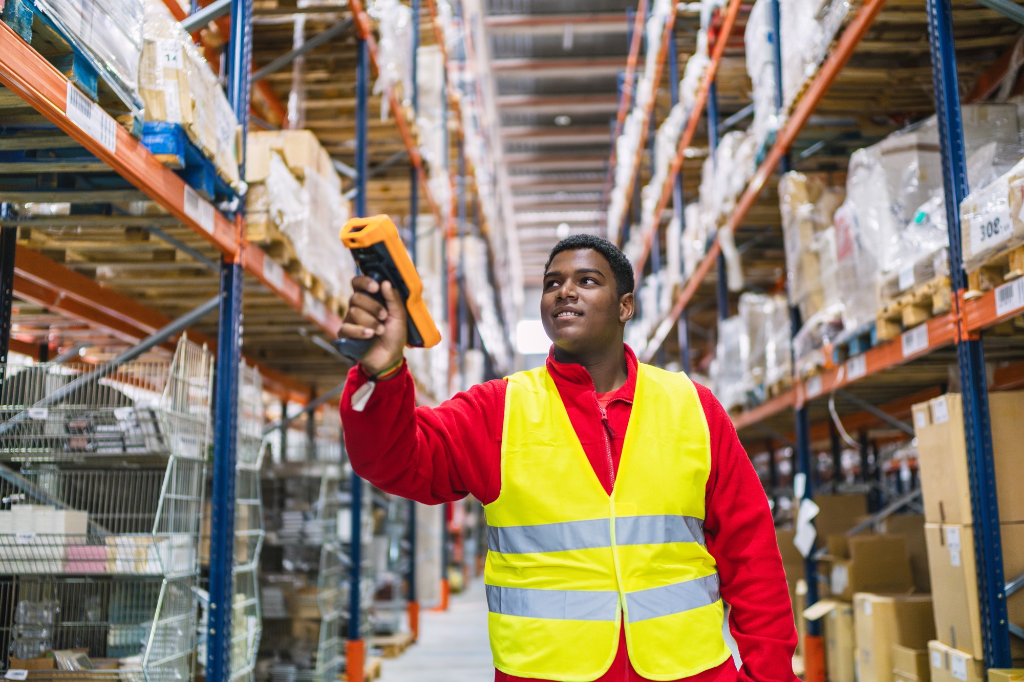 Warehouse worker scanning inventory with barcode reader