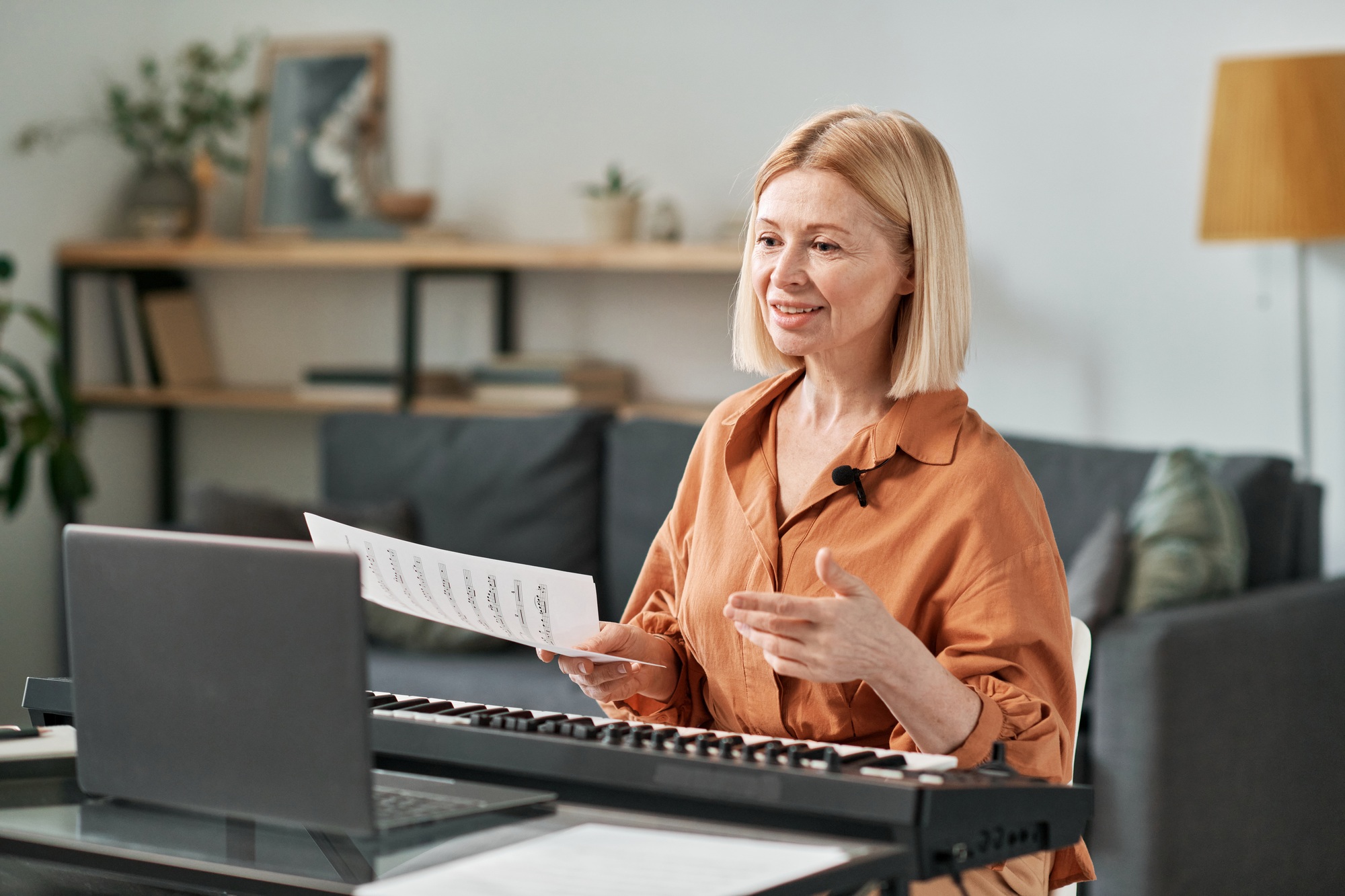 Woman teaching musical lesson online