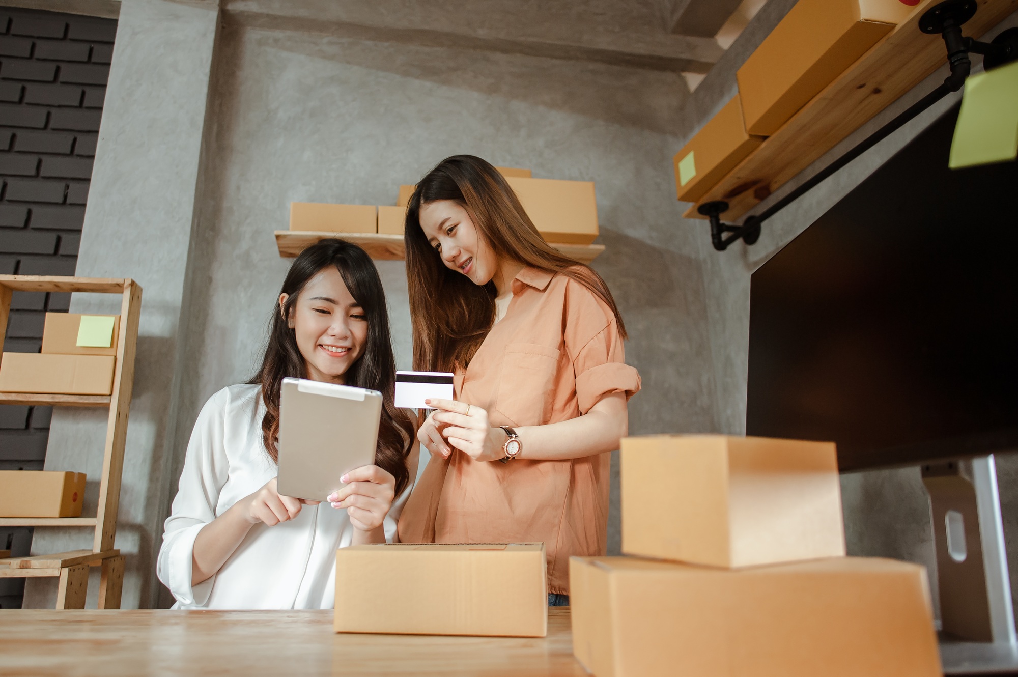 Young woman asian work from home online marketing currently ordering products for sale