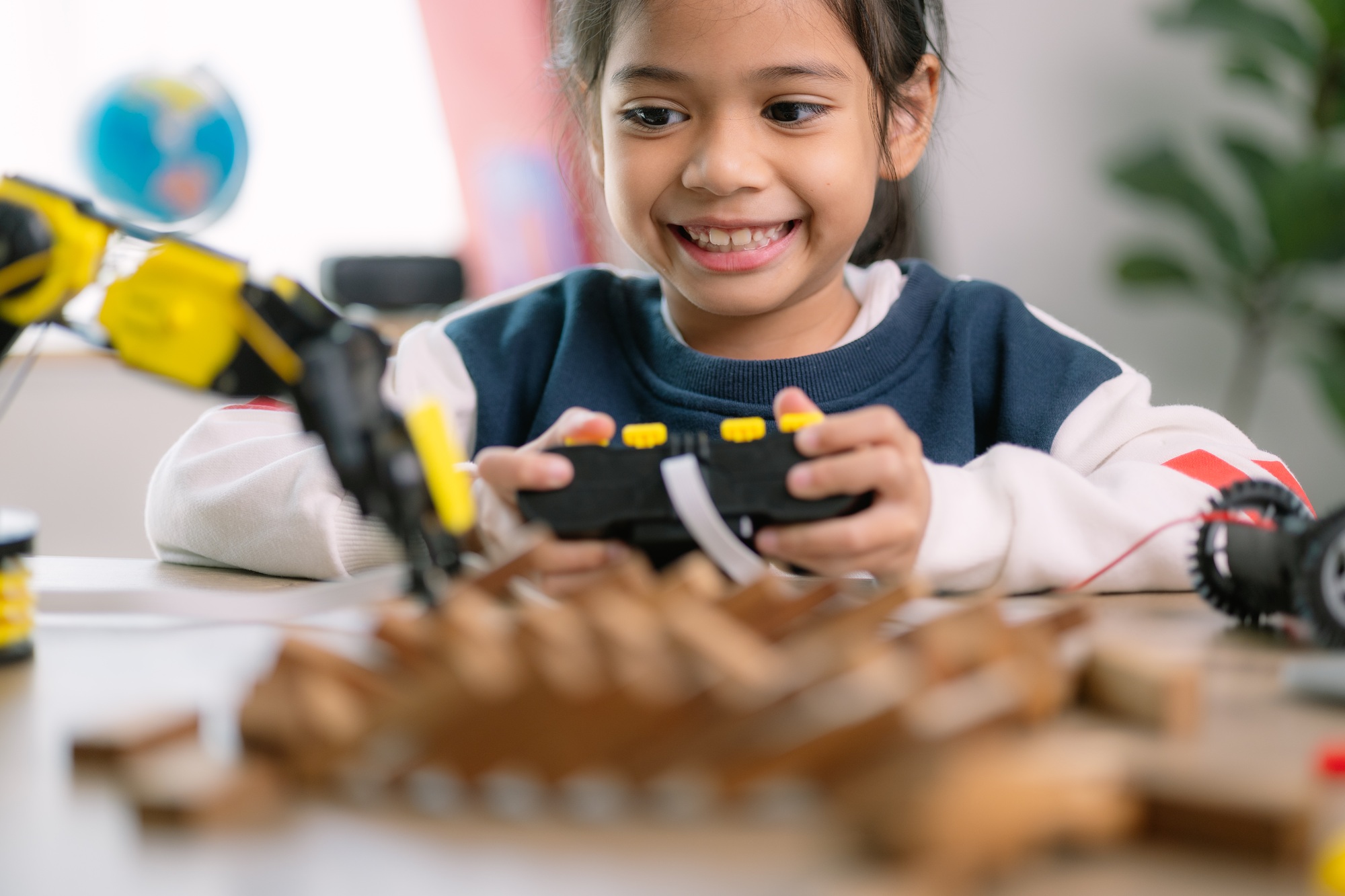 Asian girls were learning robot programming and getting lessons control on robot arms. Laboratory.