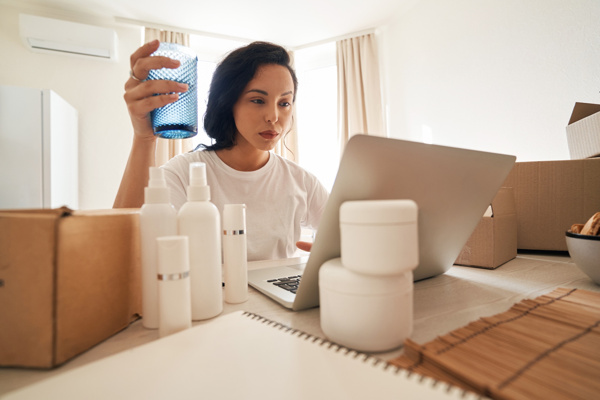 Concentrated Internet store employee processing customer order