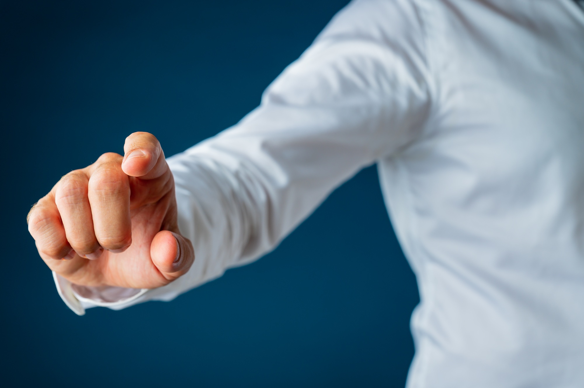 Hand of a businessman touching virtual interface screen