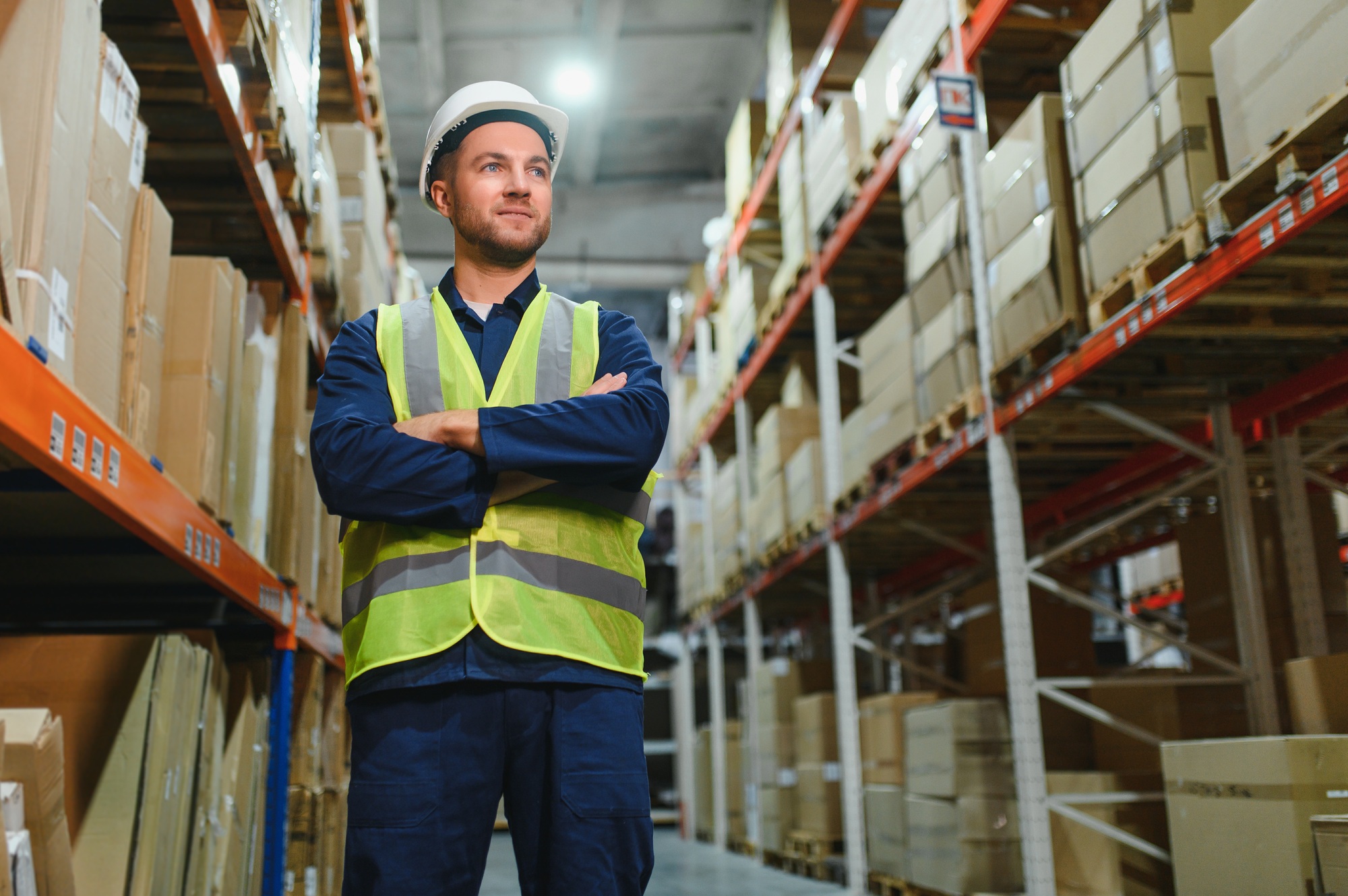 Warehouse, shipping and man walking in a distribution, freight and supply chain company.